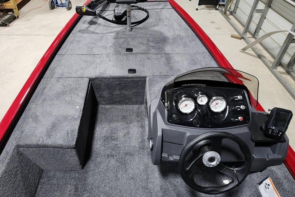 2026 Tracker Pro 170 boat interior with steering console and carpeted deck.