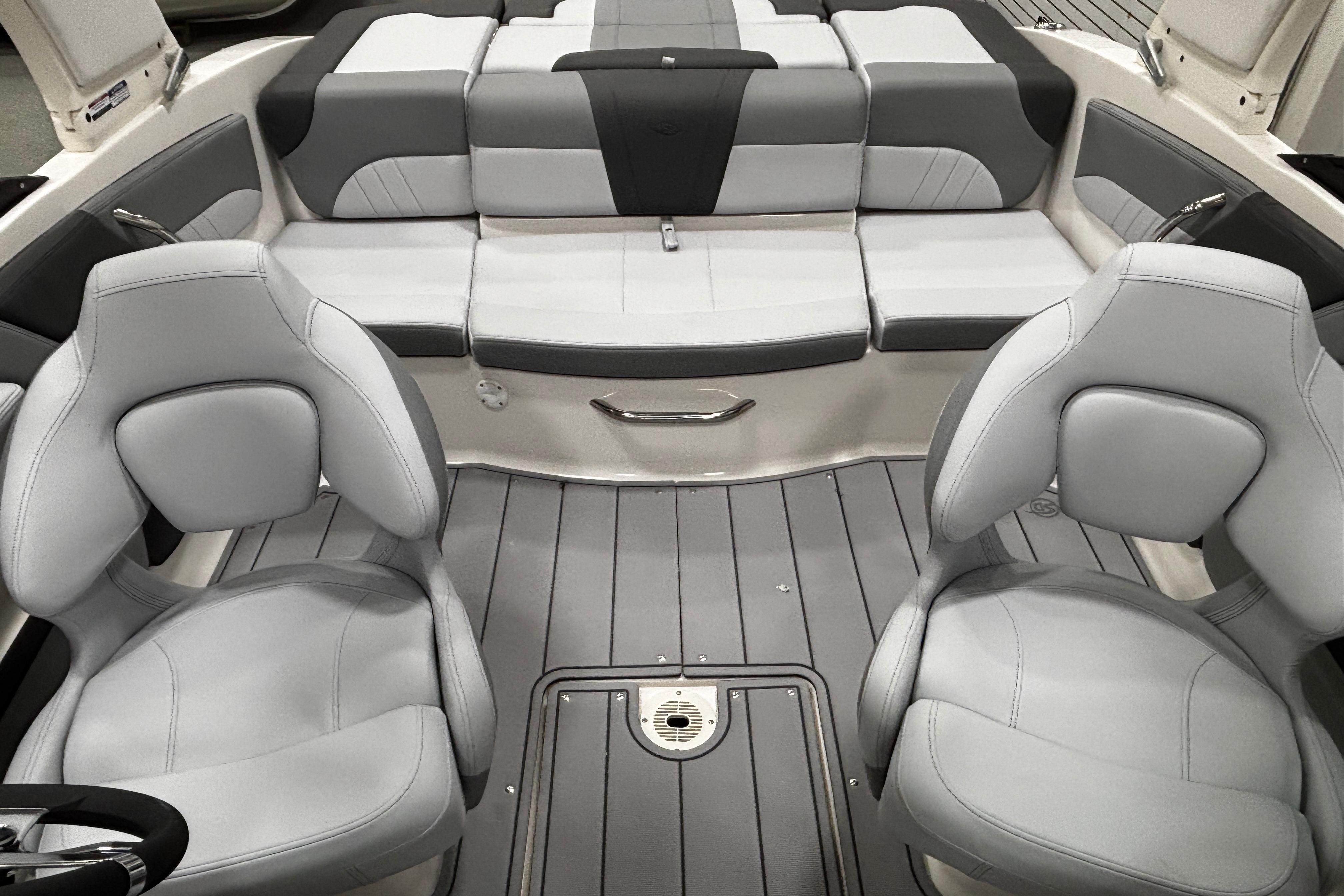 Interior of 2026 Chaparral 21 SSi boat with gray seating and modern design.