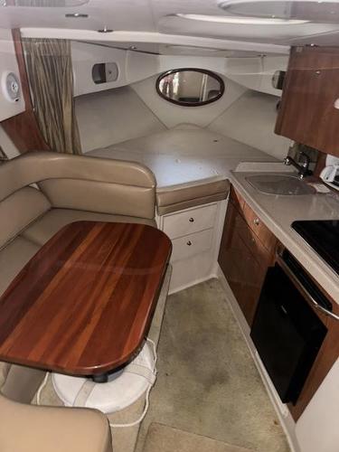 Interior of 2005 Four Winns 298 Vista boat with kitchen and seating area.