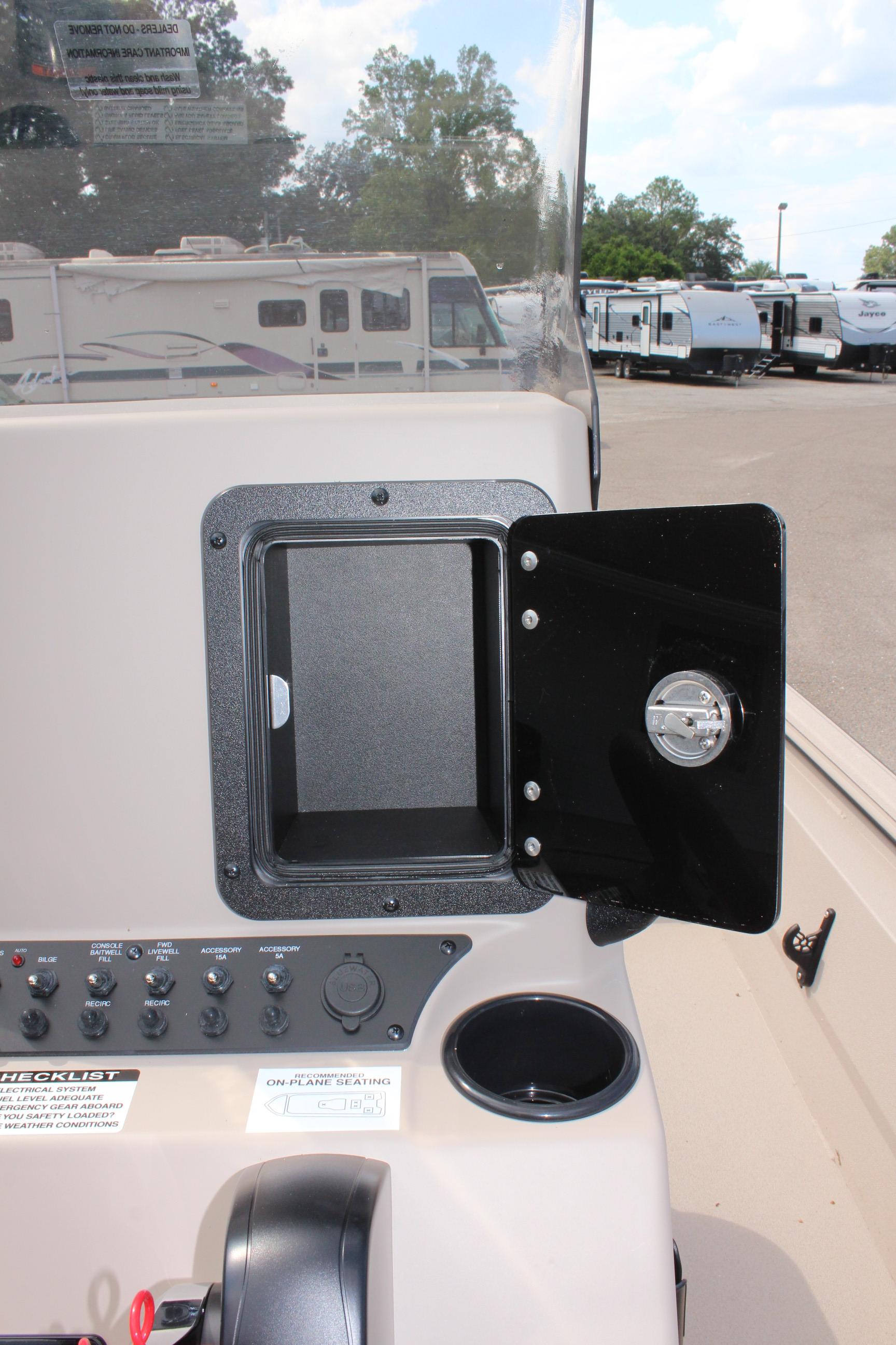 2025 Avid 18 Rogue CC boat dashboard with open storage compartment.