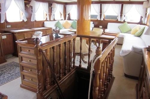 Luxurious 1962 Custom Southern yacht interior with elegant woodwork and plush seating.