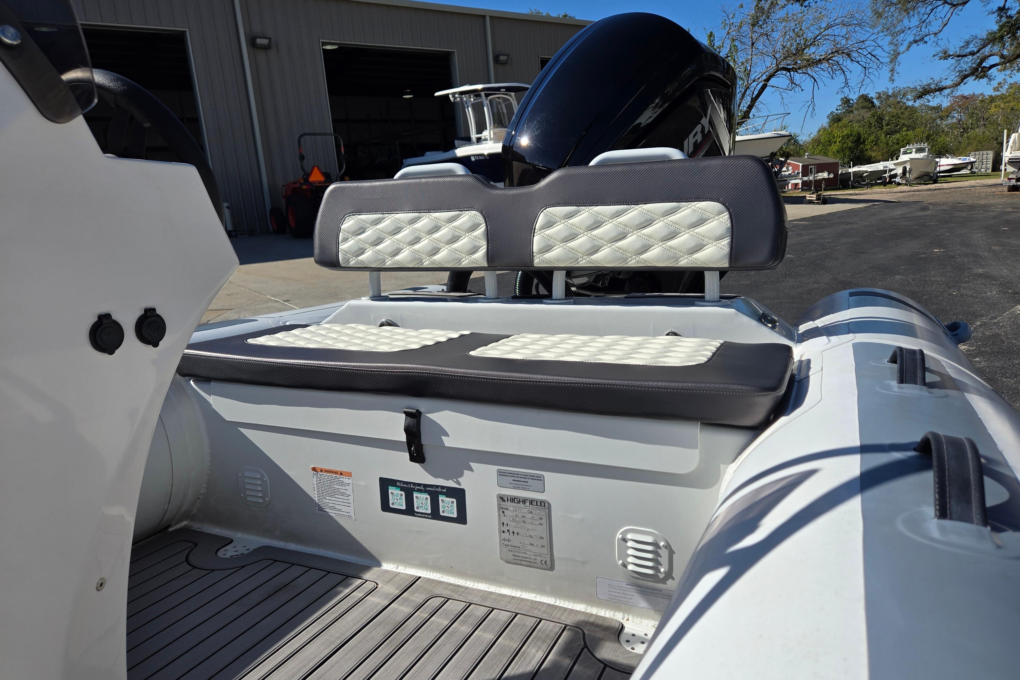 2024 Highfield Sport 460 boat interior with cushioned seating and modern design.