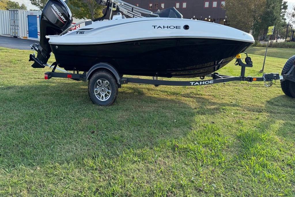 2026 Tahoe T16 boat on trailer, parked on grassy area.