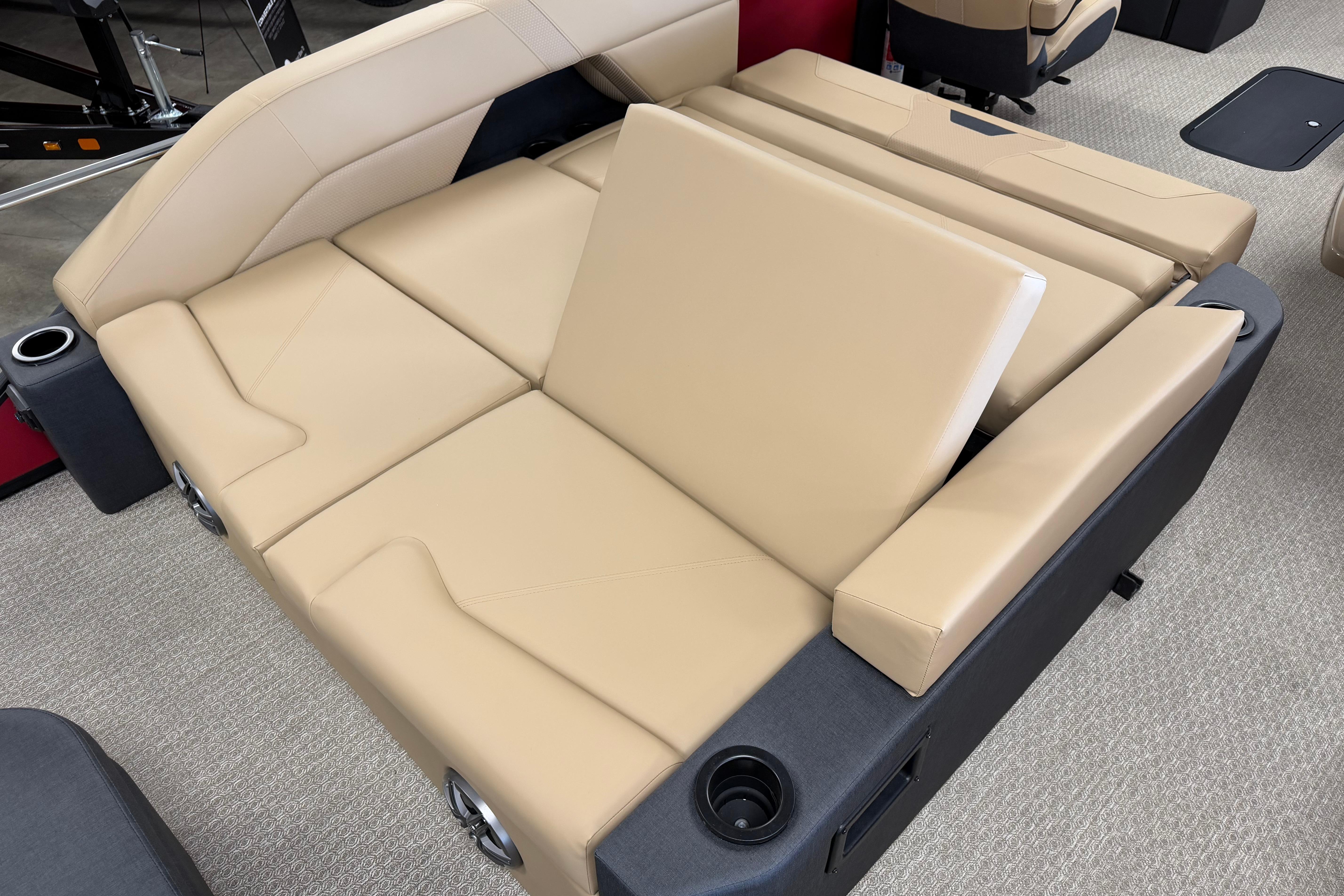 Beige leather seating in 2026 Evotti 523CS boat, featuring cup holders and modern design.