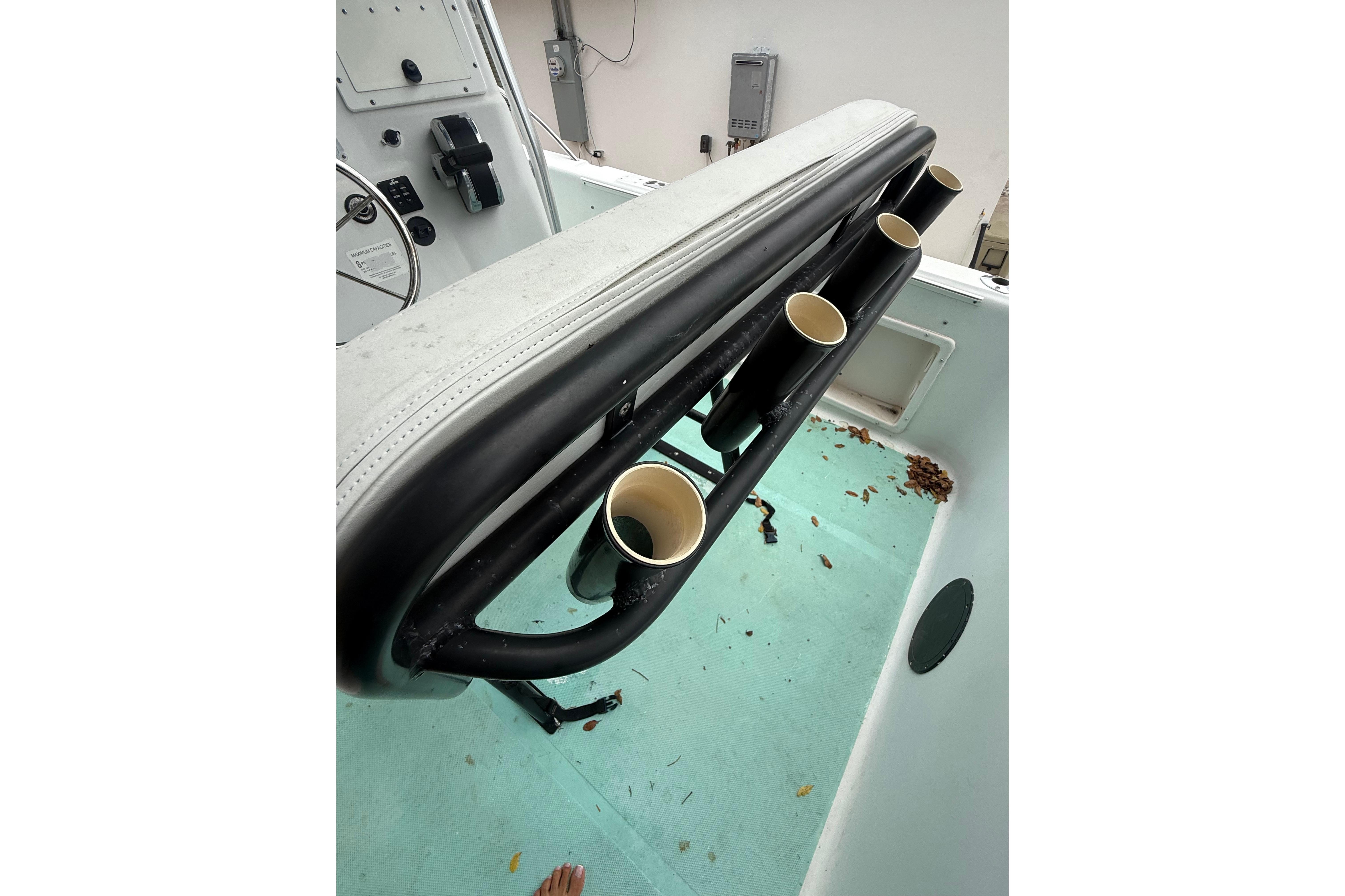2005 LYG Sea Fox boat interior with rod holders and control panel.