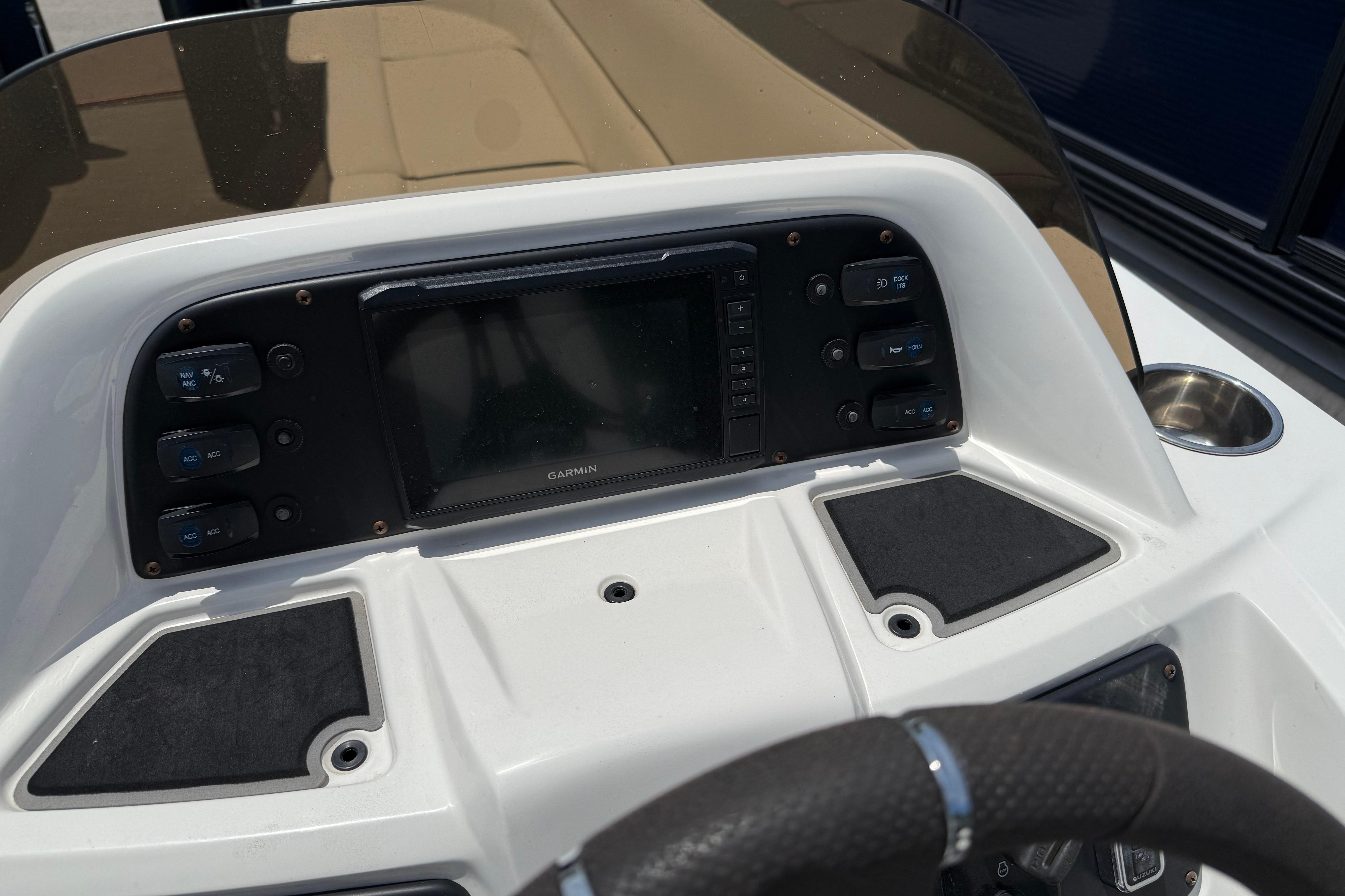 2022 Manitou Aurora LE dashboard with Garmin display and control buttons.