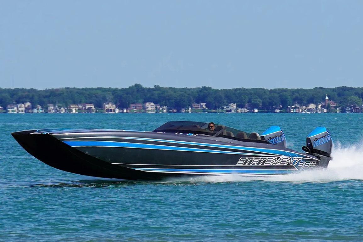 Manufacturer Provided Image: High-speed Statement 360 CAT boat cruising on a lake, 2026 model, with twin Racing 500 engines.