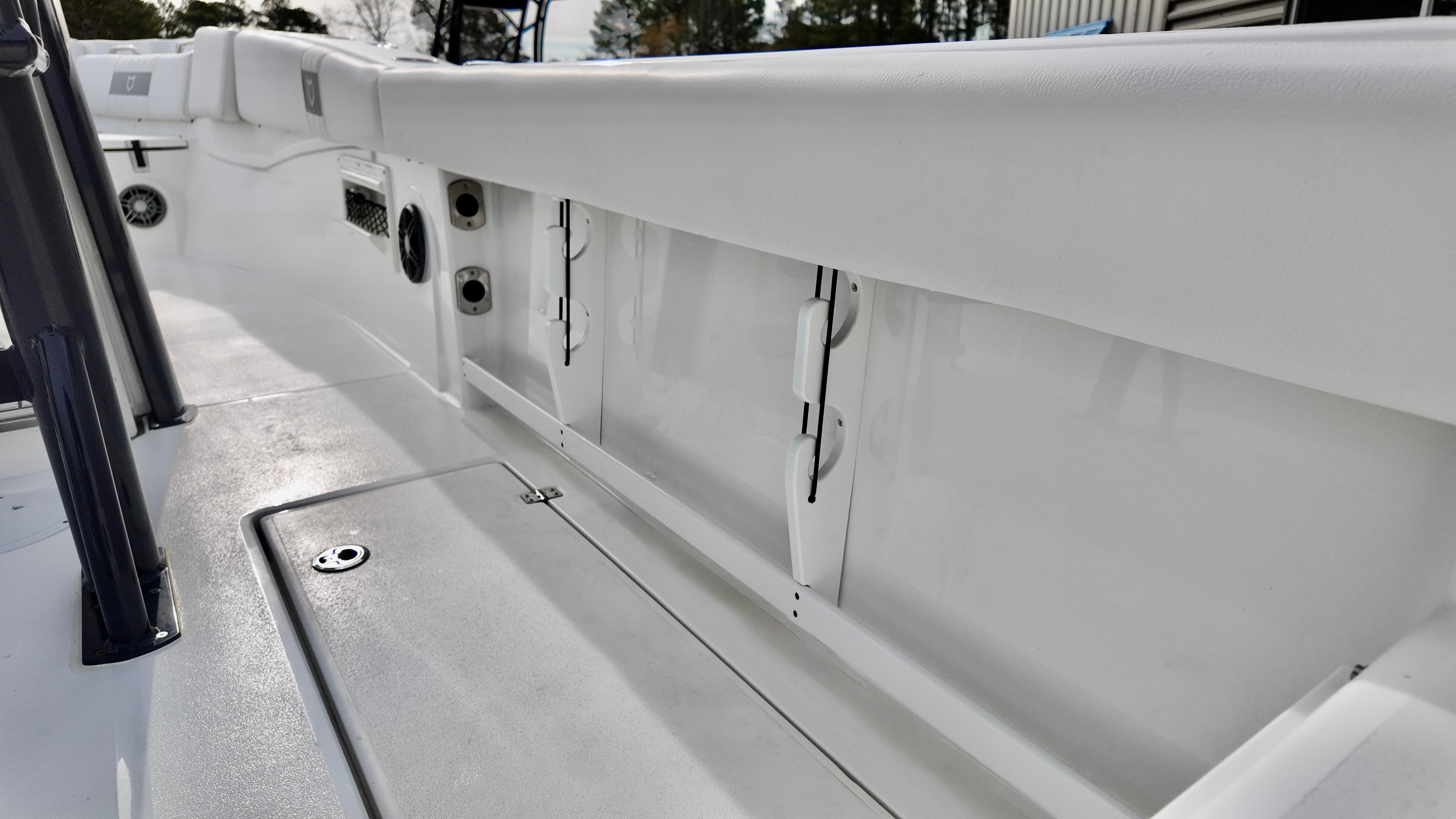 2025 Sea Fox 268 Commander boat interior, showcasing sleek white design and storage compartments.