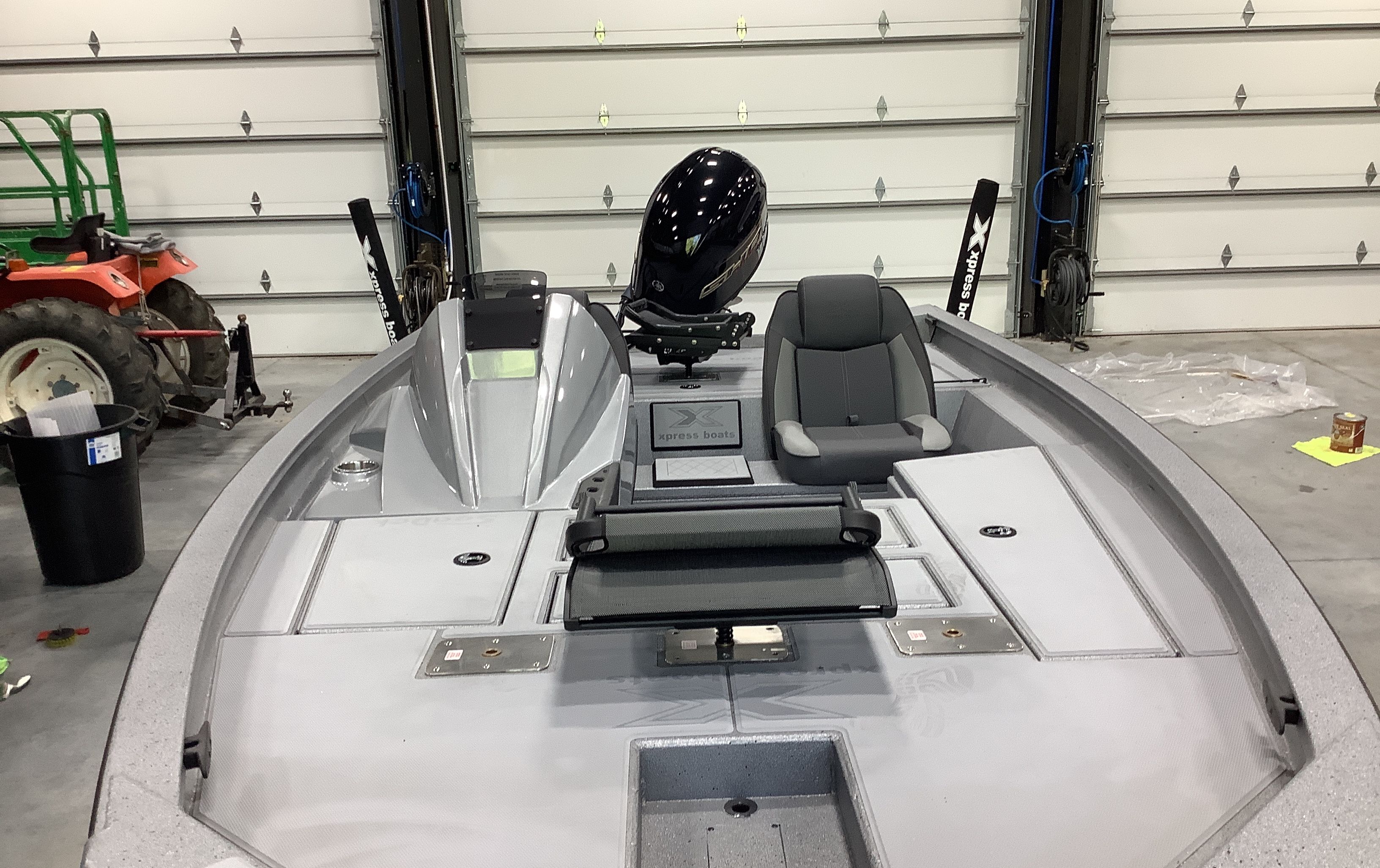 2026 Xpress Boats H18C in a garage, interior view.