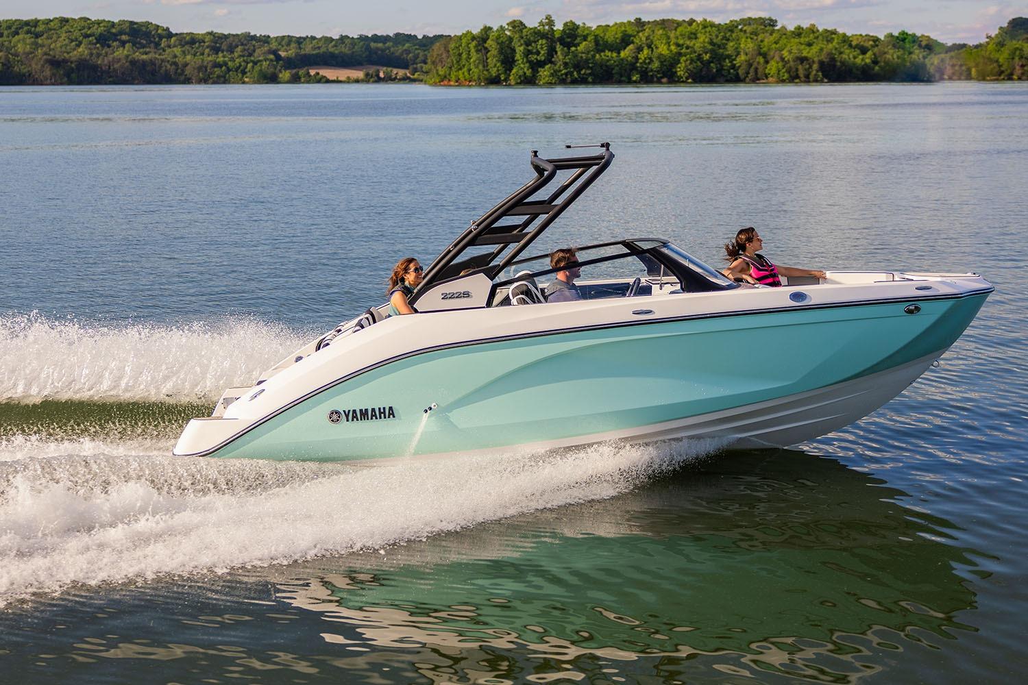 Manufacturer Provided Image: 2026 Yamaha Boats 222S cruising on a serene lake with passengers enjoying the ride.