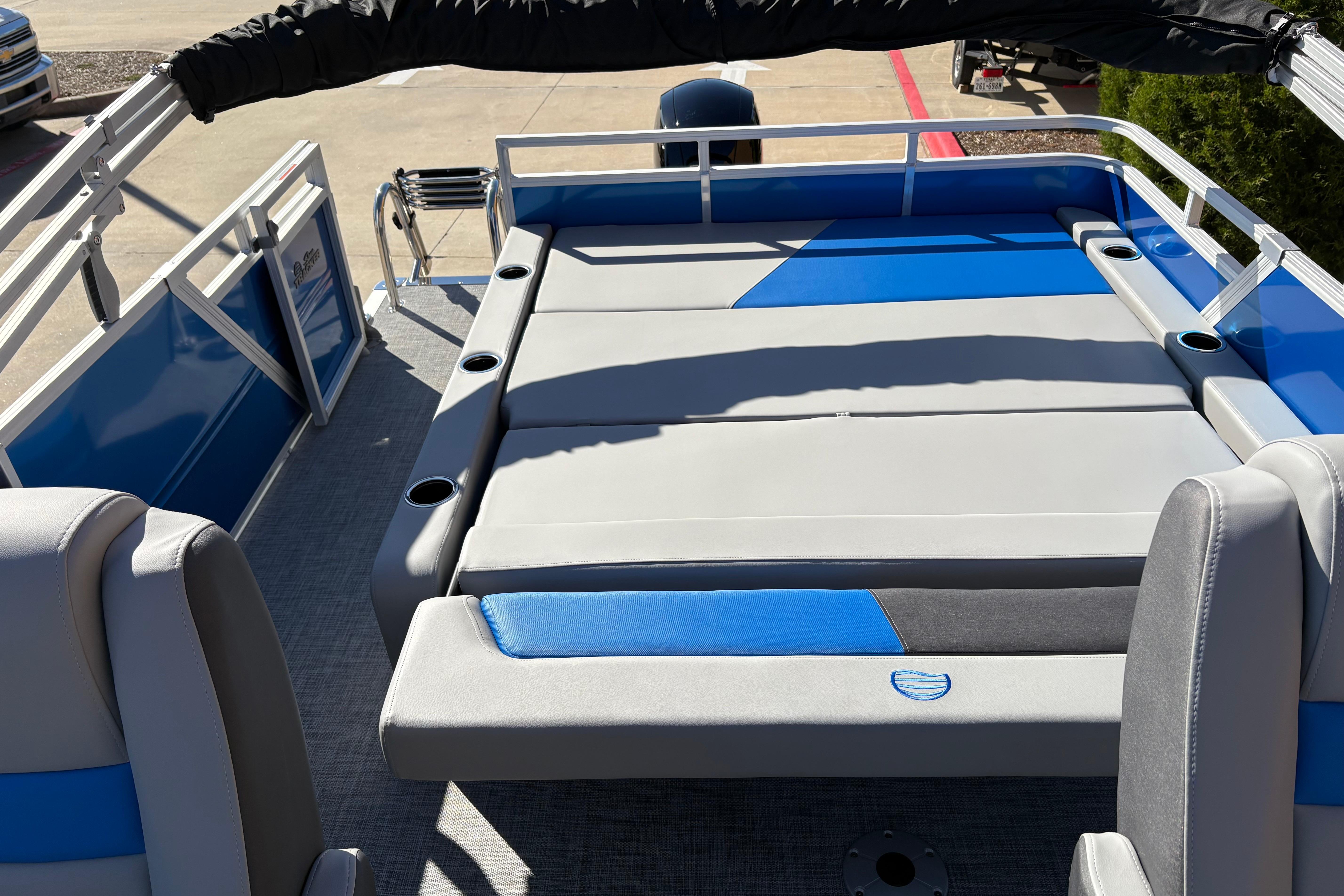 2026 Sun Tracker Party Barge 22 RF XP3 interior with blue and gray seating.