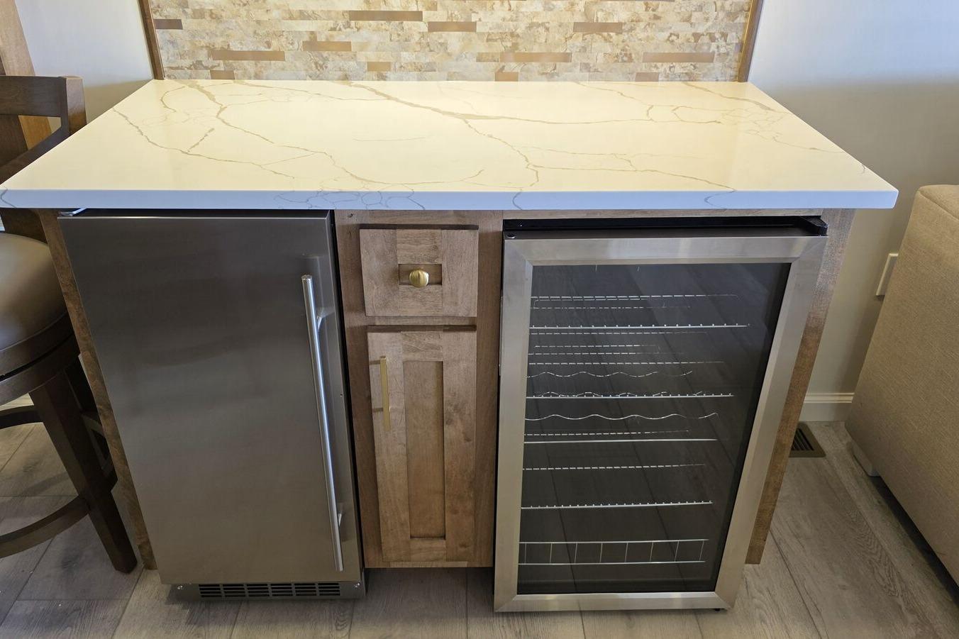 Modern kitchen counter with stainless steel appliances and marble countertop, Sumerset Excellence 2025 model.