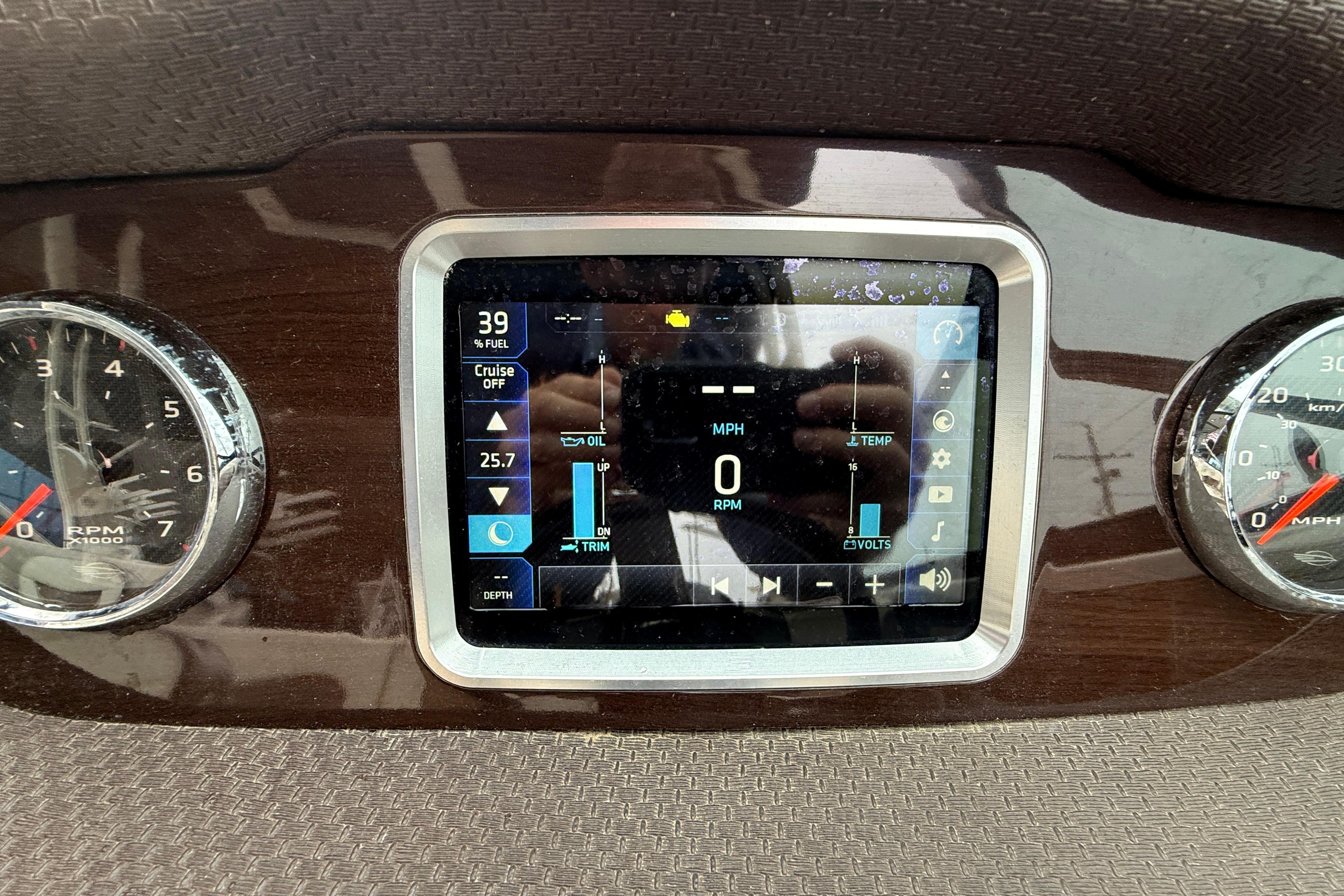 Dashboard of 2018 Chaparral 227 SSX Surf boat with digital display and gauges.