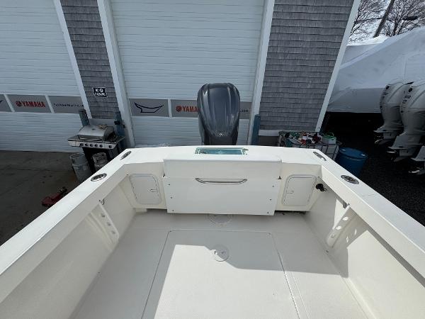 2025 NorthCoast 230 Center Console boat interior with Yamaha engine in a garage setting.