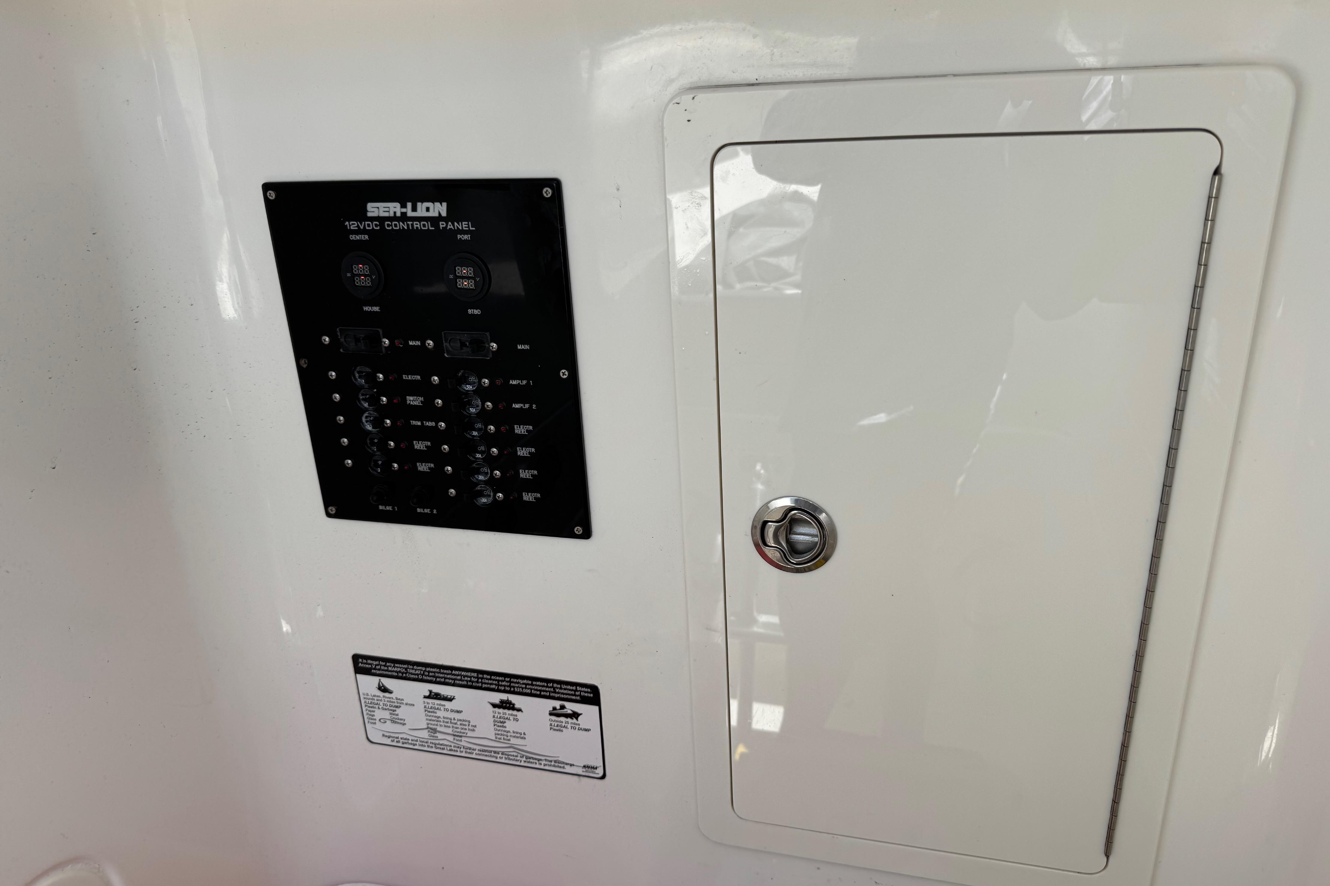 Sea-Lion 34 TE 2020 model 12V control panel with access door.