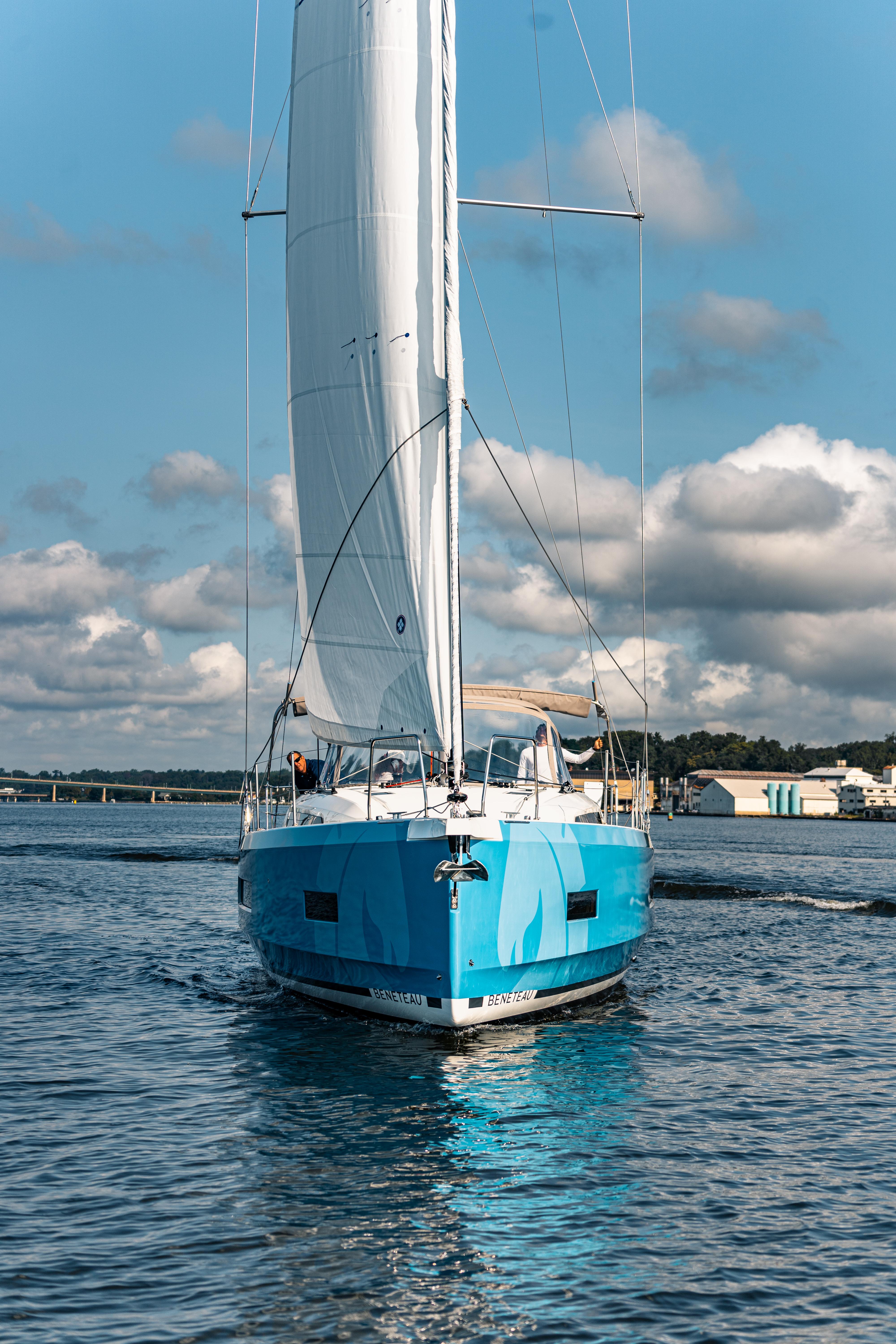 2025 Beneteau Oceanis 40.1 sailboat on calm water under blue sky.