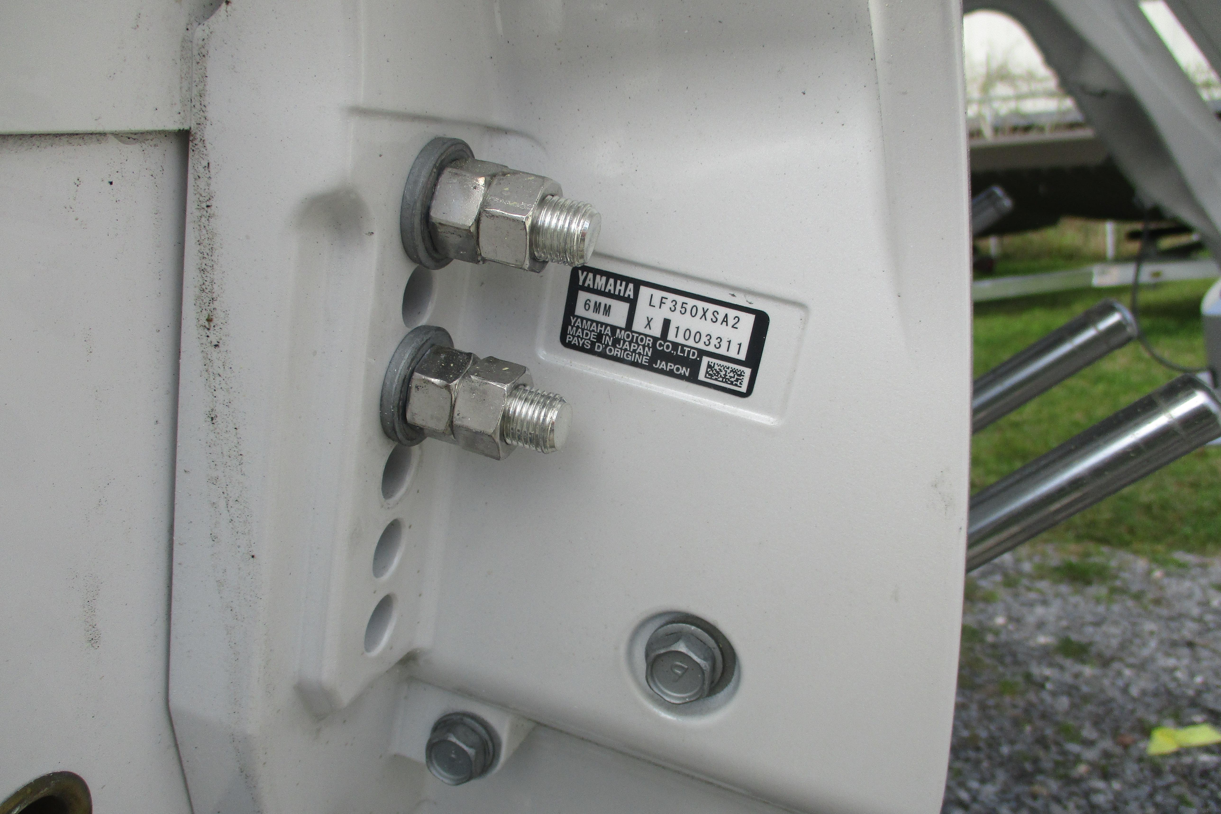Close-up of Yamaha engine mount on 2026 Sportsman Open 302 Center Console boat.