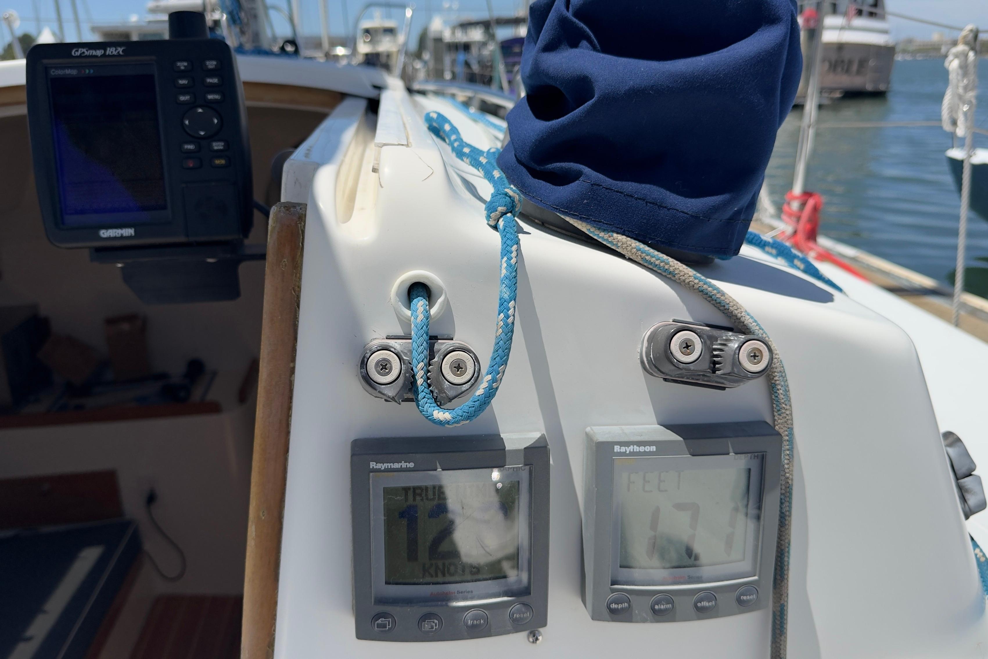 Cockpit of 1994 J Boats J/92 with navigation instruments and rope details.