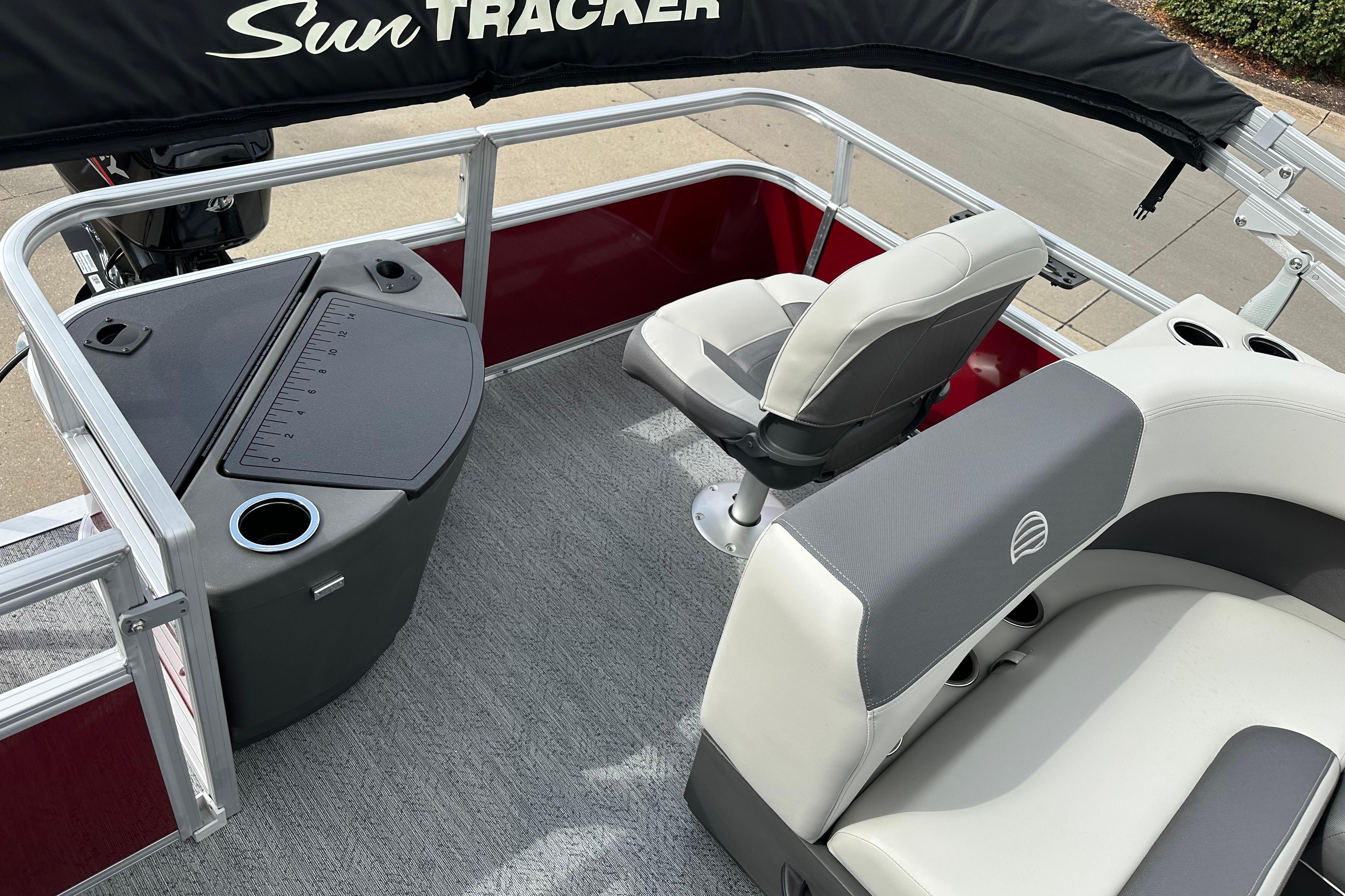 2026 Sun Tracker Bass Buggy 18 DLX pontoon boat interior with seating and console.