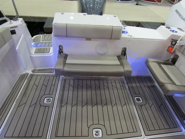 2025 Cutwater C-248 Coupe boat interior with cushioned seating and non-slip flooring.