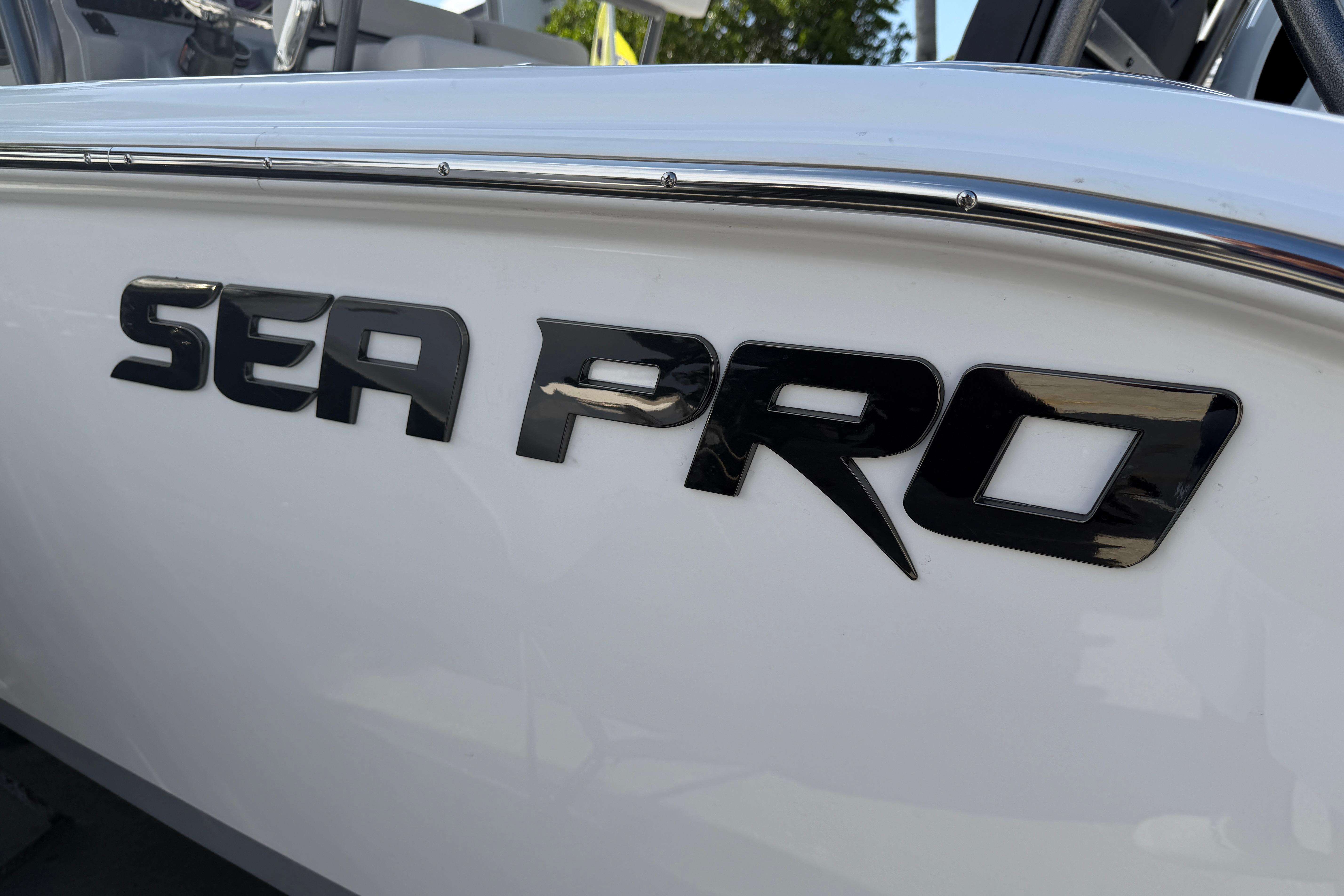 2026 Sea Pro 225FLX Sandbar boat logo on sleek white hull.