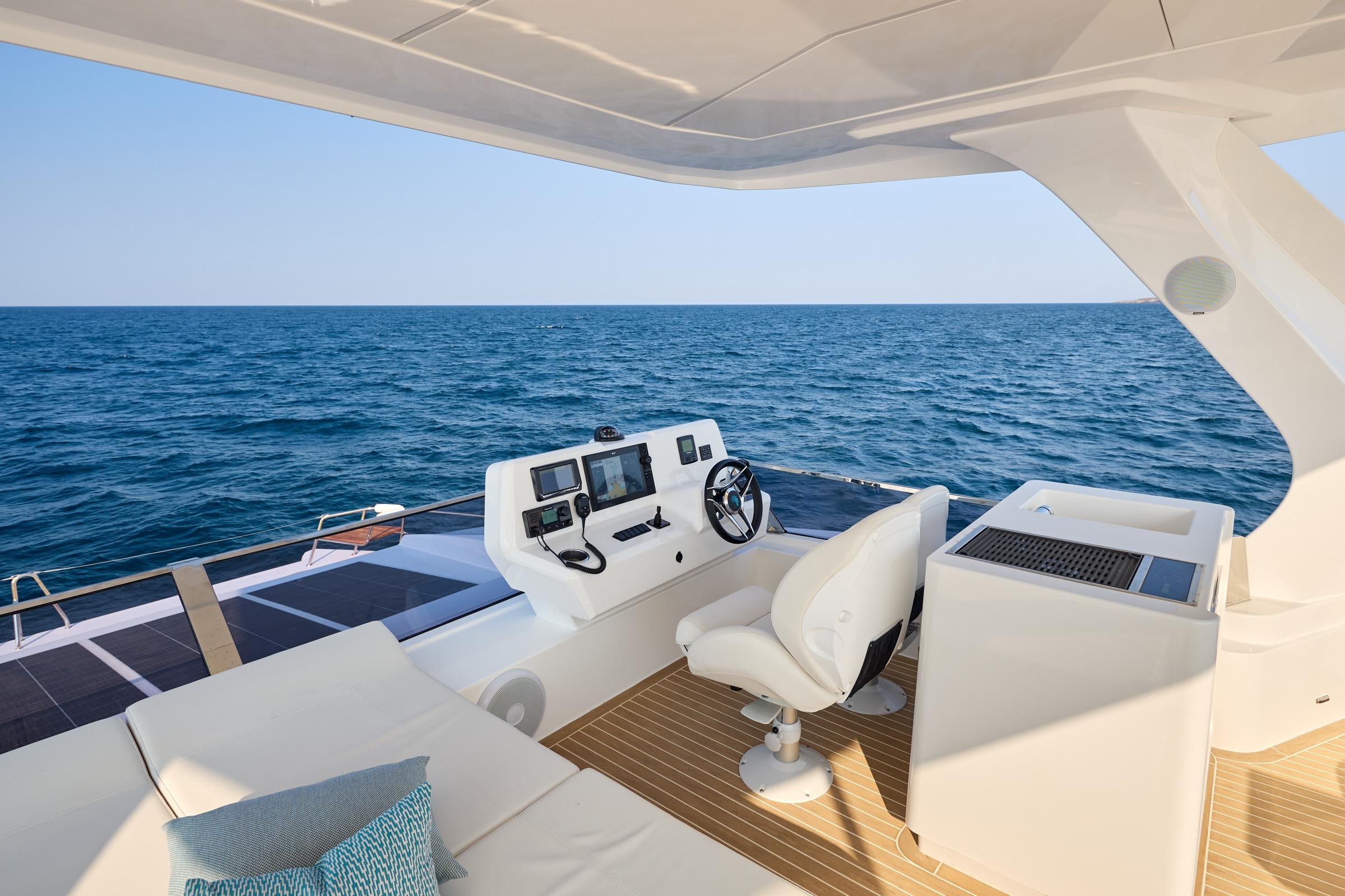 Luxurious 2025 Omaya 50 Power Catamaran helm overlooking the ocean.