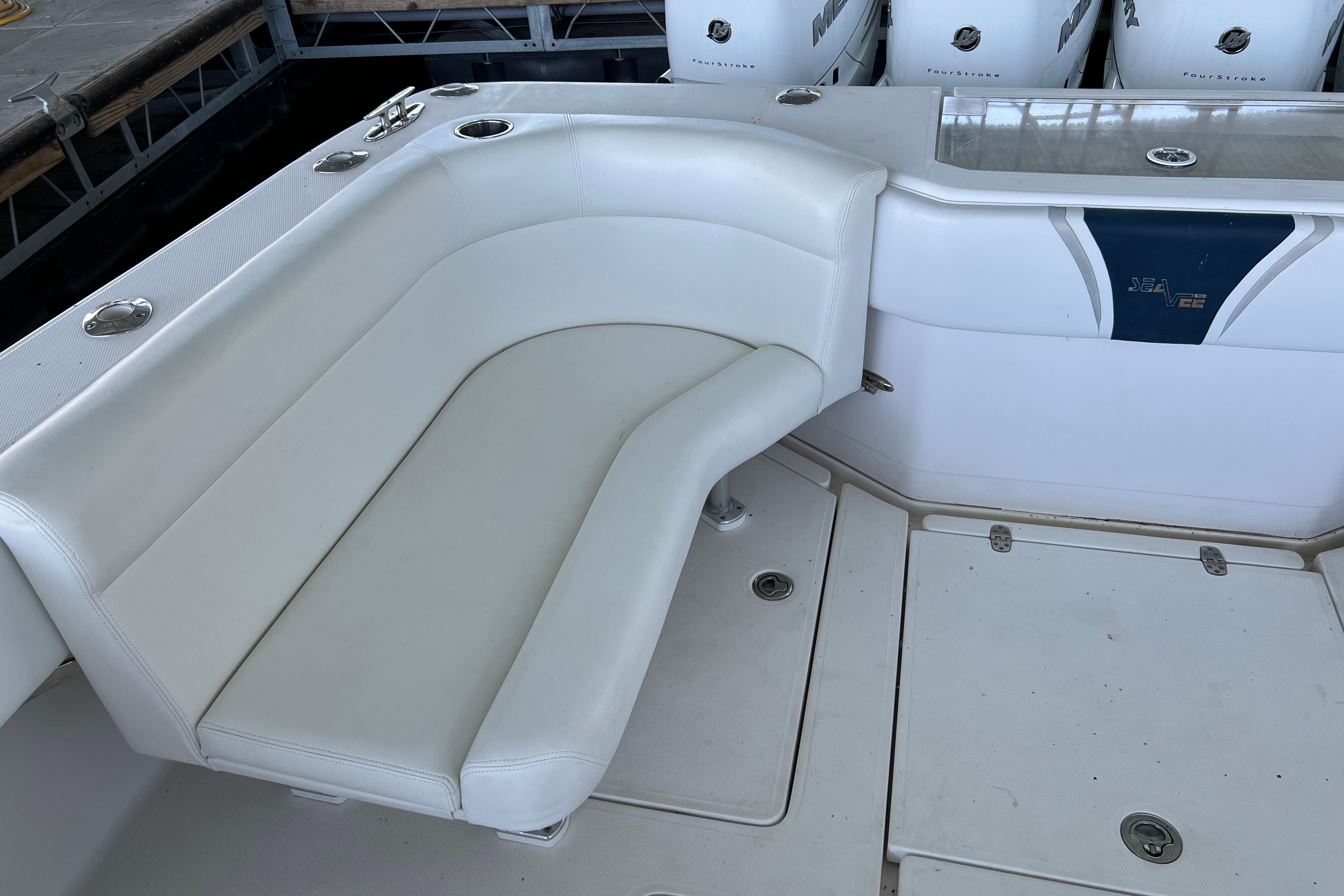 White seating area on a 2008 SeaVee 39 boat with multiple outboard engines.