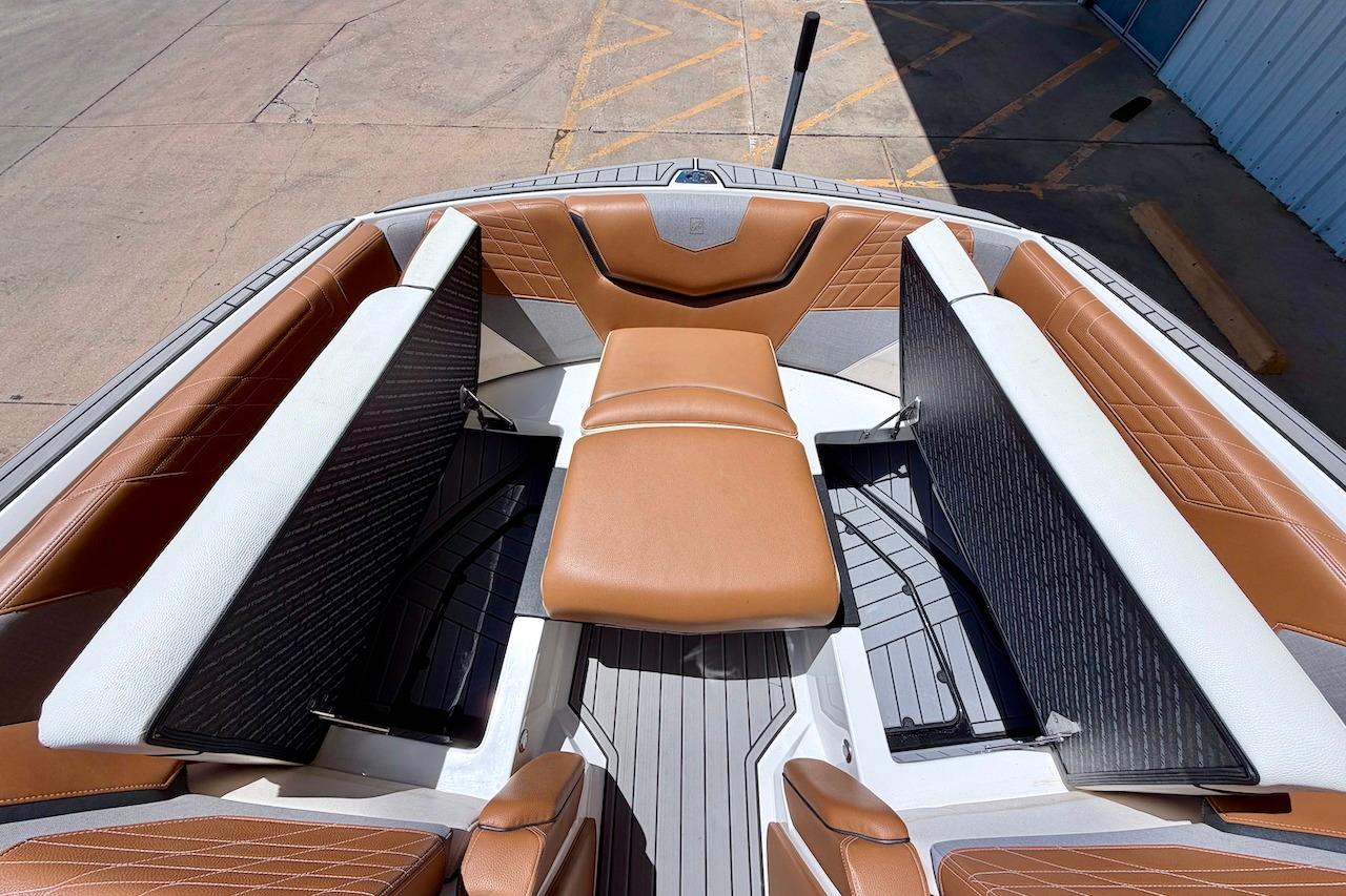 2021 Nautique Super Air Nautique G23 boat interior with tan and white seating.