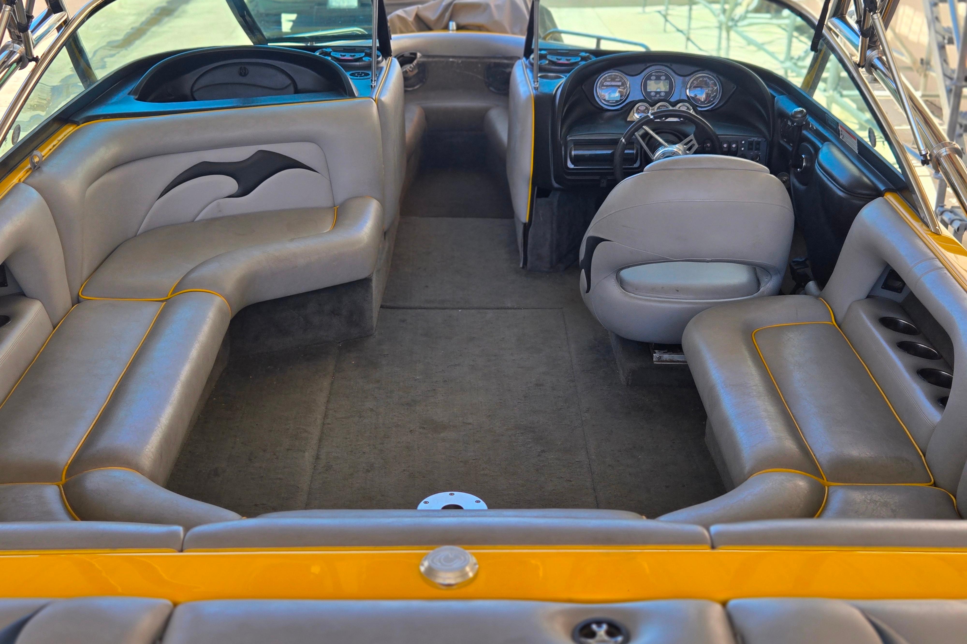 Interior of 2007 Calabria CAL AIR PRO V boat with gray seating and dashboard.