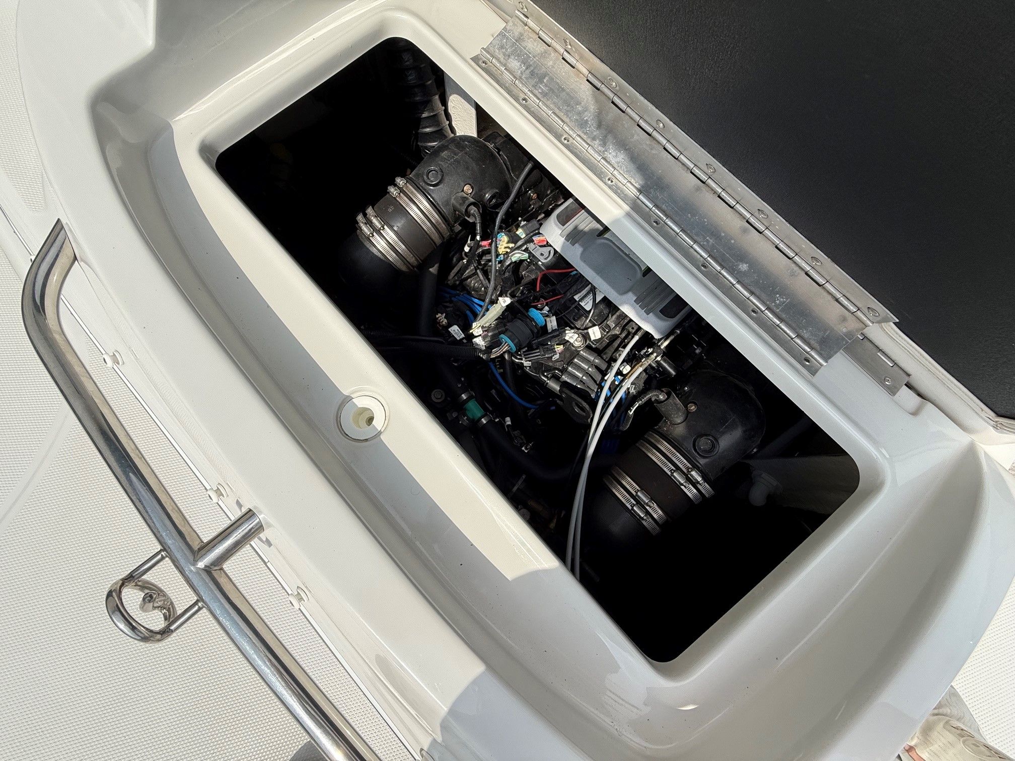 Engine compartment of a 2012 Crownline 252 EX boat with visible engines.