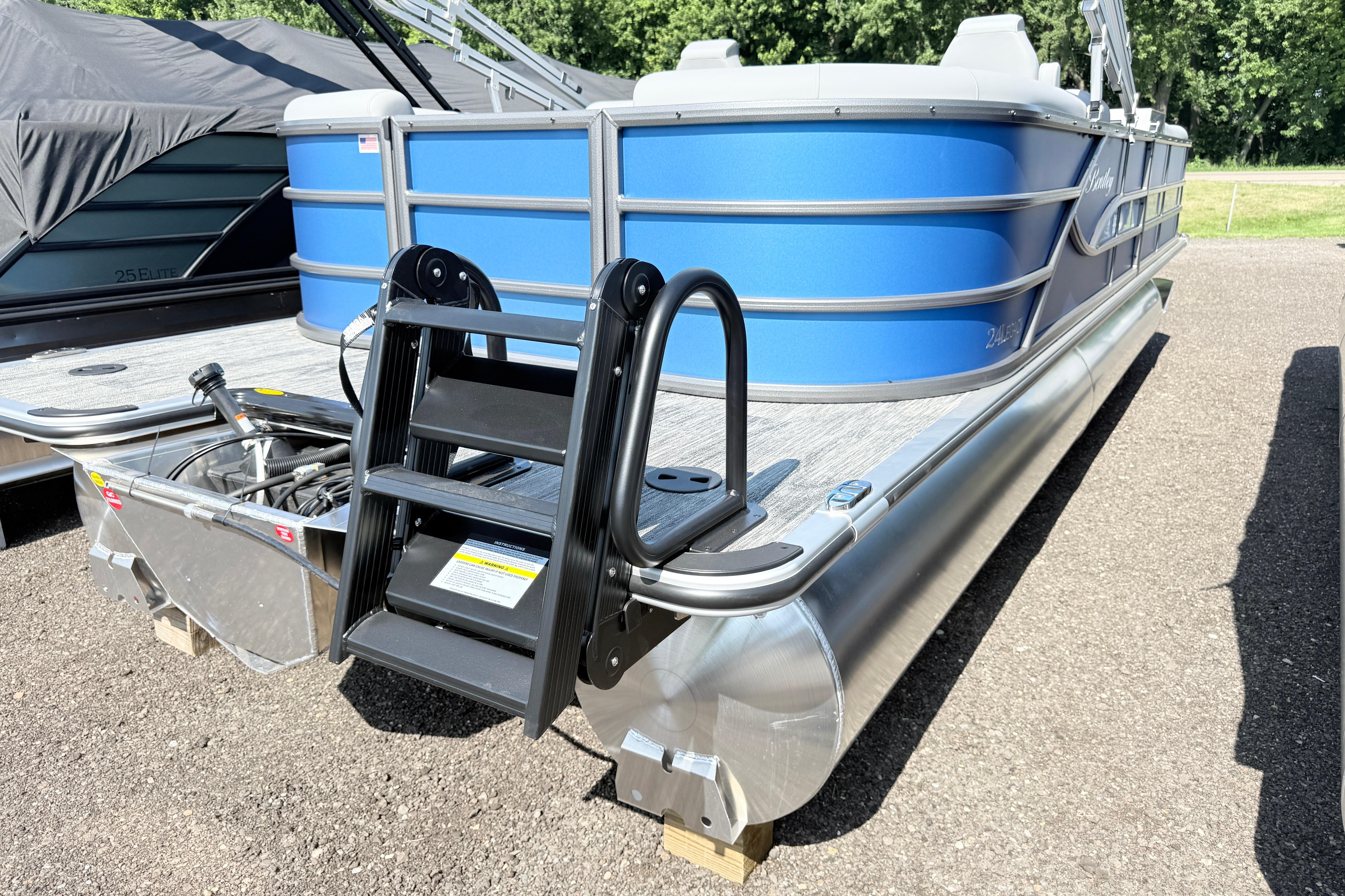 2027 Bentley Pontoons Legacy 240 Navigator, blue exterior, docked on a sunny day.