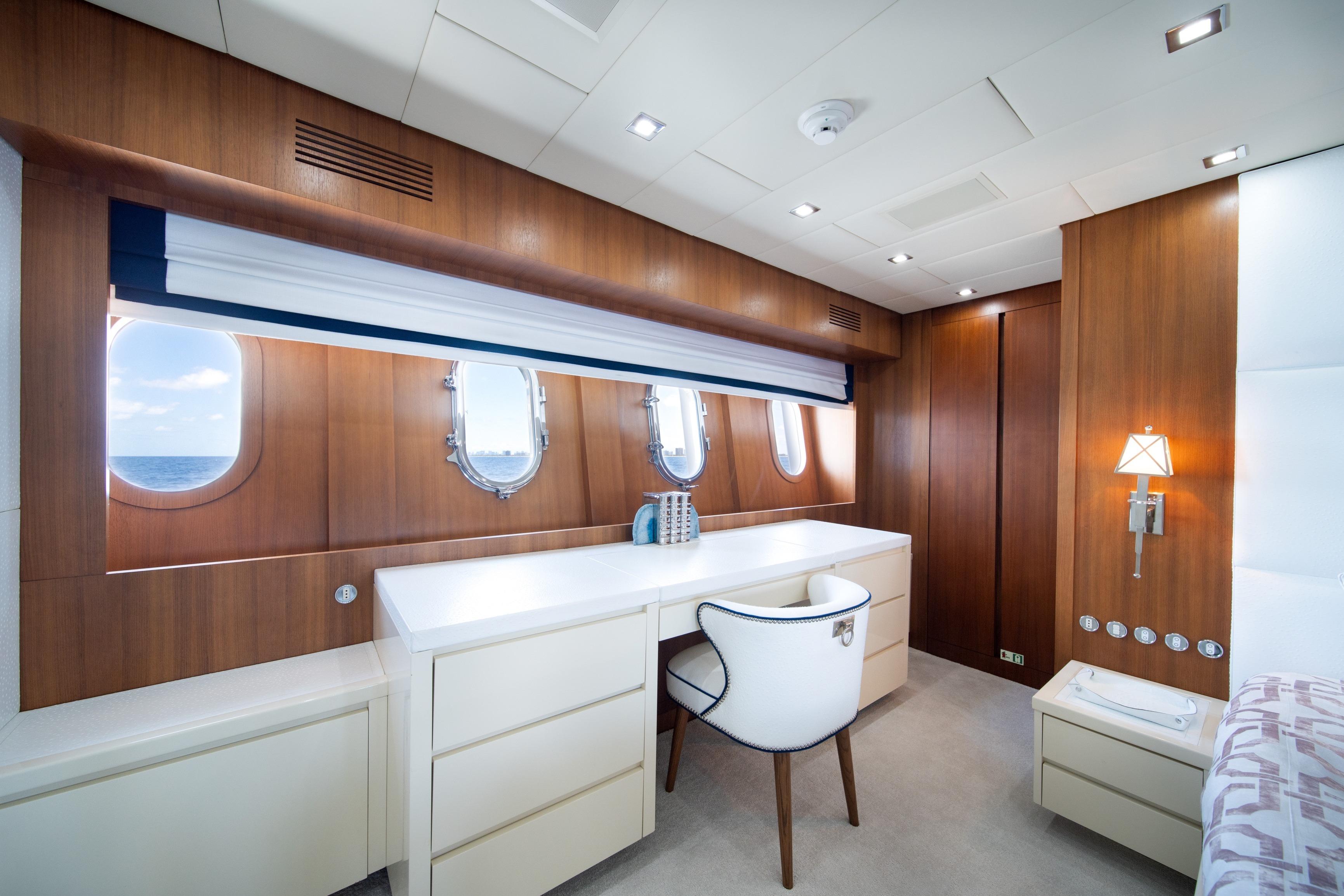 Luxurious interior of 2008 Arno Leopard 31 yacht with elegant wood paneling and modern furnishings.