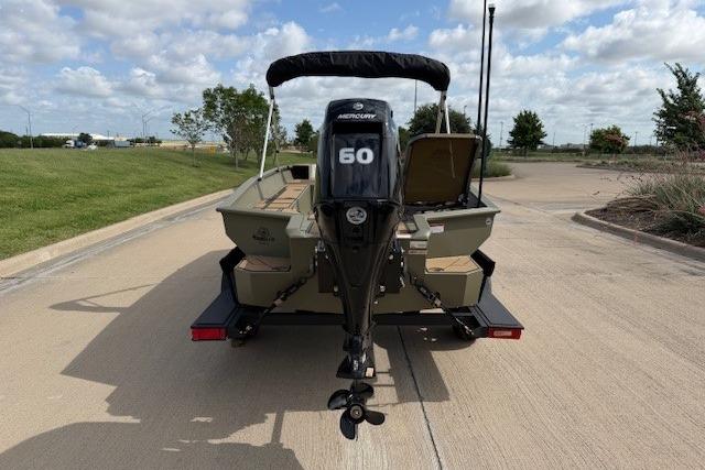 2026 Tracker Grizzly 1756 T Marsh boat with Mercury 60 engine on a sunny day.