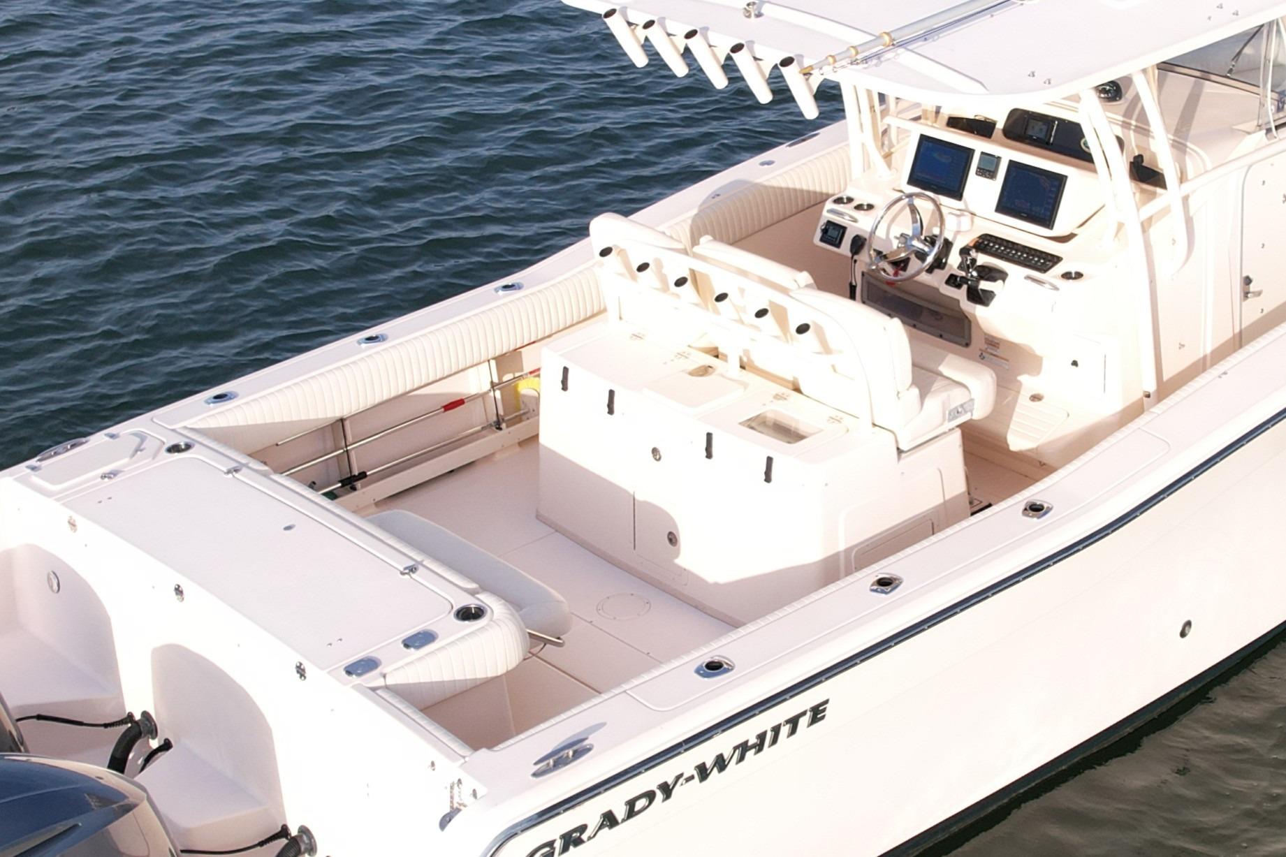 2012 Grady-White Canyon 336 boat on water, featuring spacious deck and modern controls.