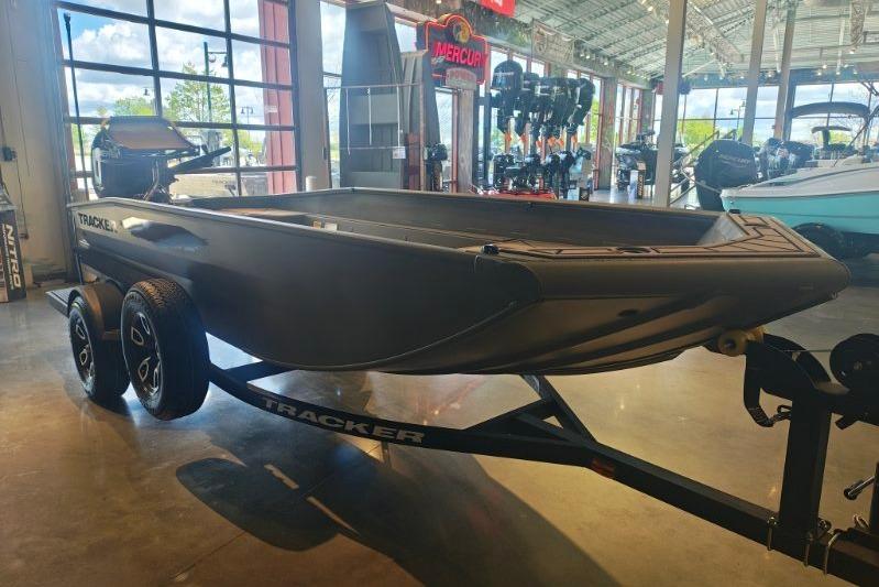 2026 Tracker Grizzly 1650 T Prairie Wings Edition boat on display in showroom.