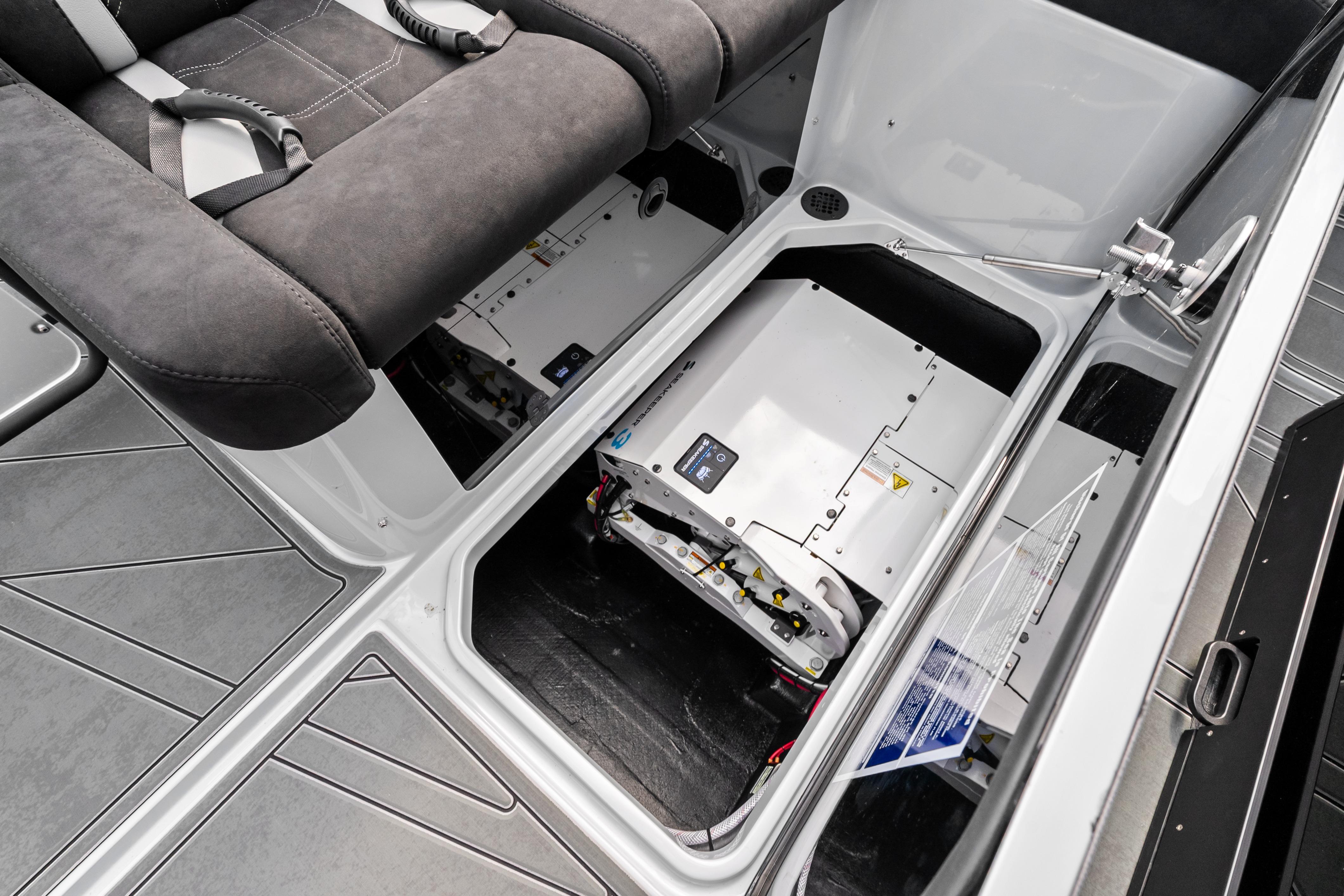 2027 Mystic Powerboats M4200 interior storage compartment with advanced equipment and seating.