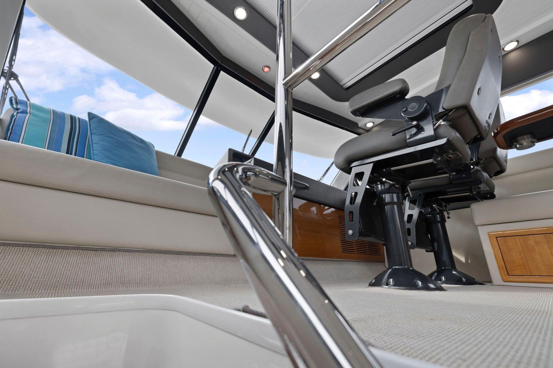 2014 Maritimo M50 yacht interior with captain's chair and modern design elements.