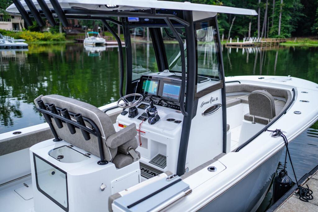 Manufacturer Provided Image: 2026 Sea Hunt Gamefish 25 boat with modern console, docked on a serene lake.