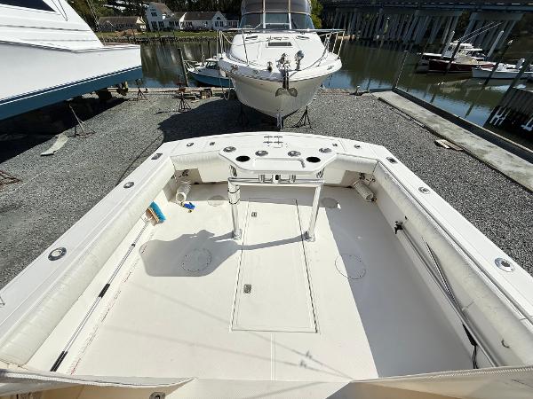 2001 Albemarle 280 Express Sport Fisherman boat, spacious deck, docked near water.