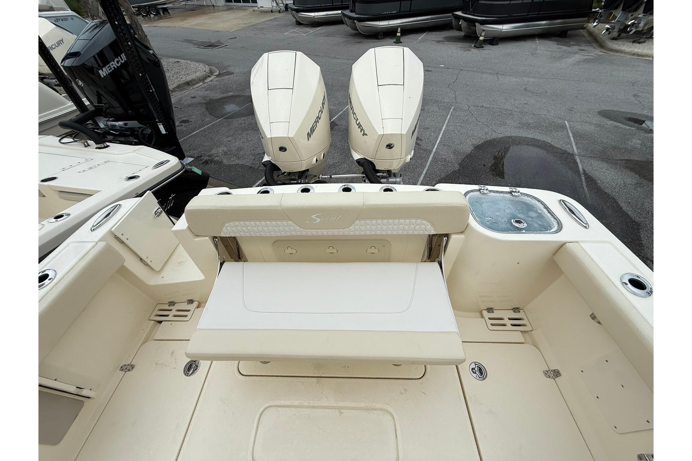 2026 Scout 260 LXF boat with dual Mercury engines, featuring a spacious deck and seating area.