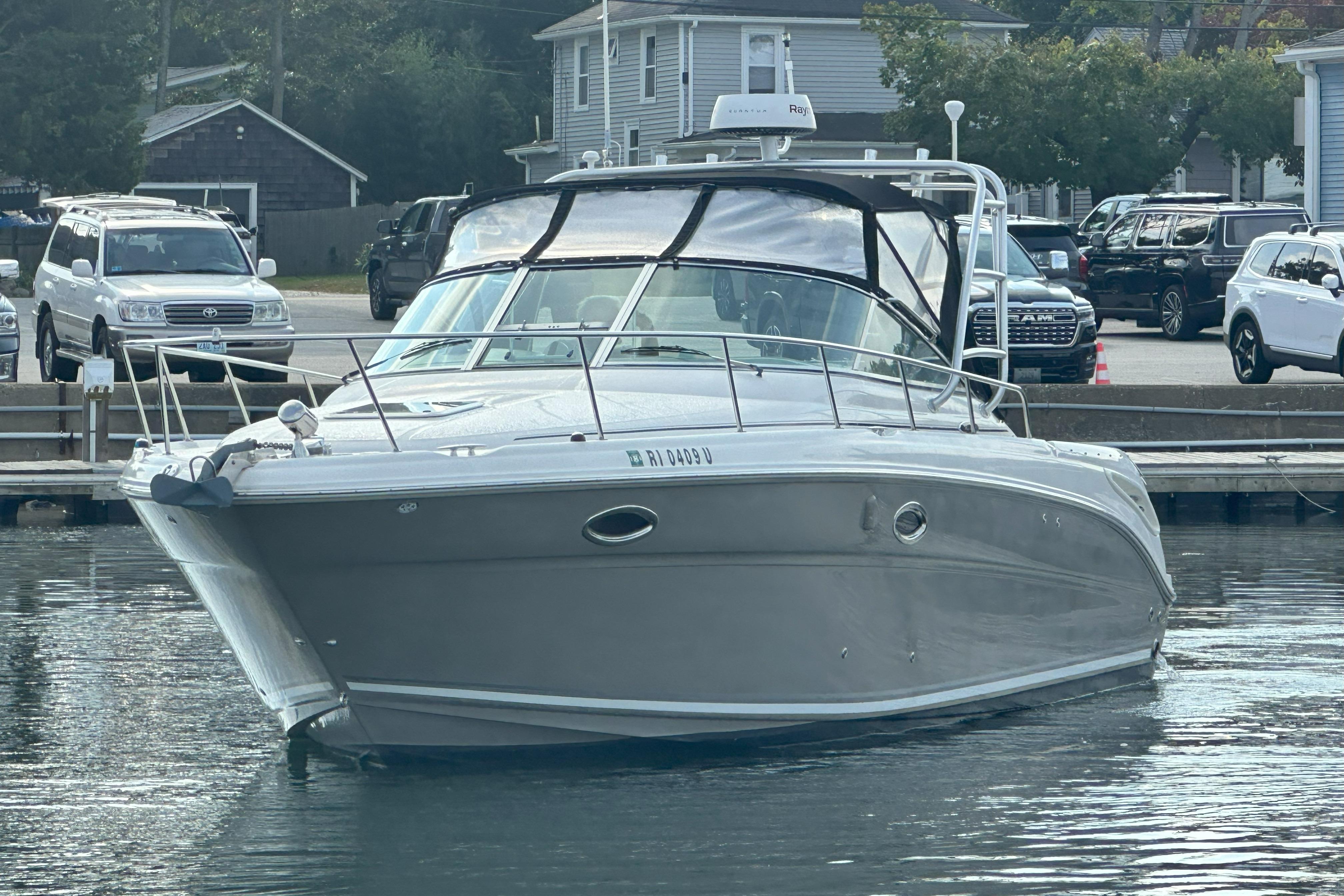 2006 Sea Ray 290 Amberjack boat docked at marina, front view.