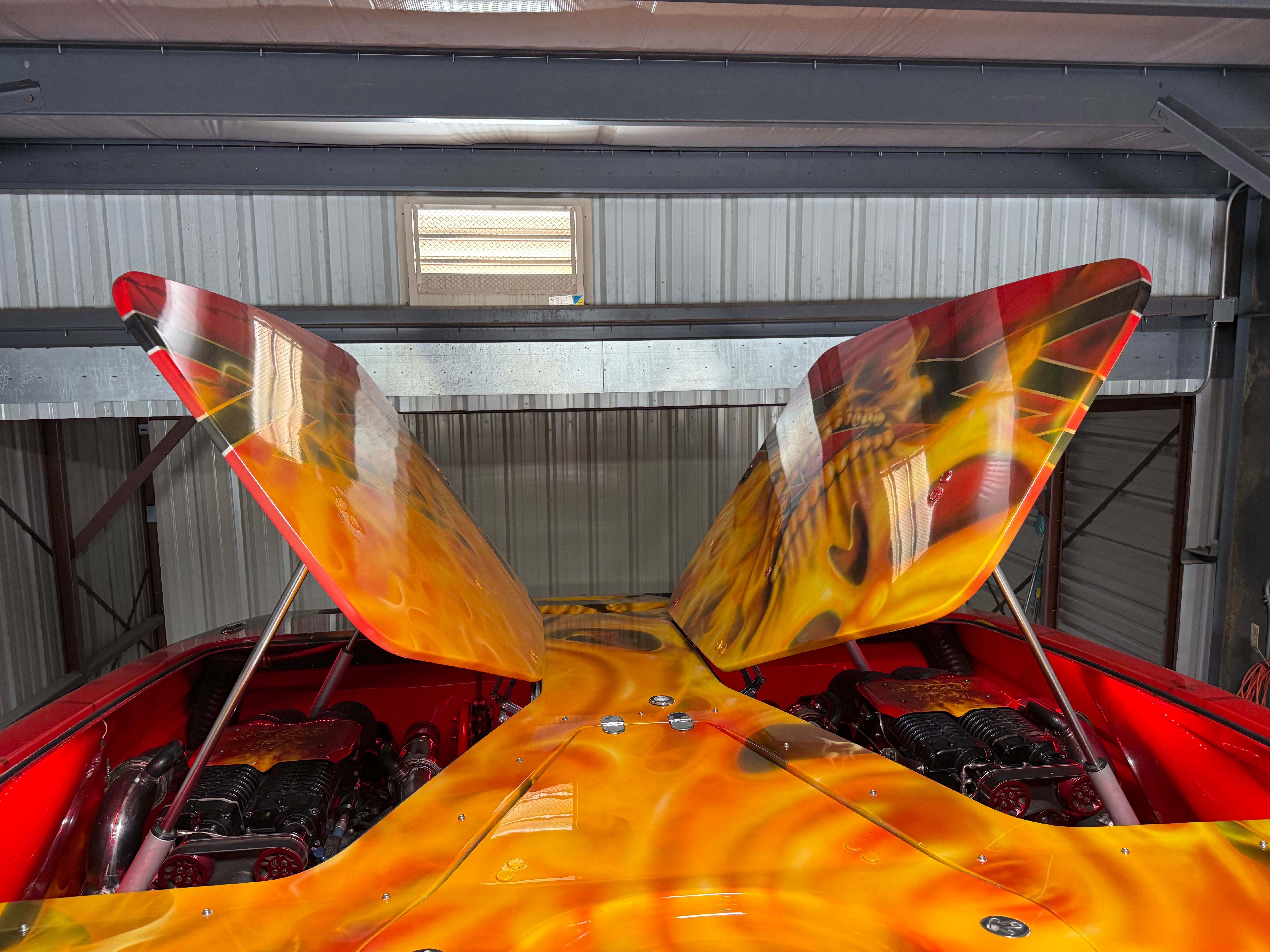A 2010 MTI CAT with striking flame design on the engine cover.