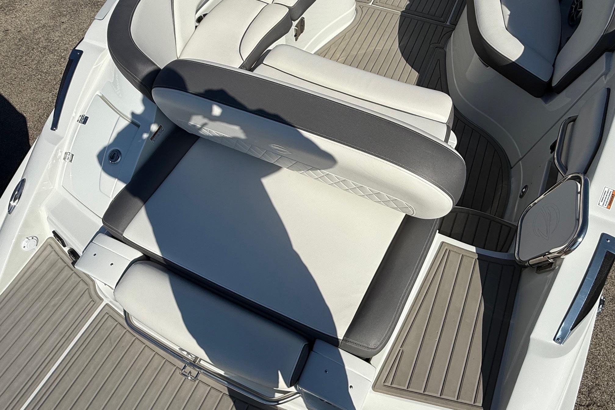 2023 Crownline 290 SS boat interior with cushioned seating and sleek design.