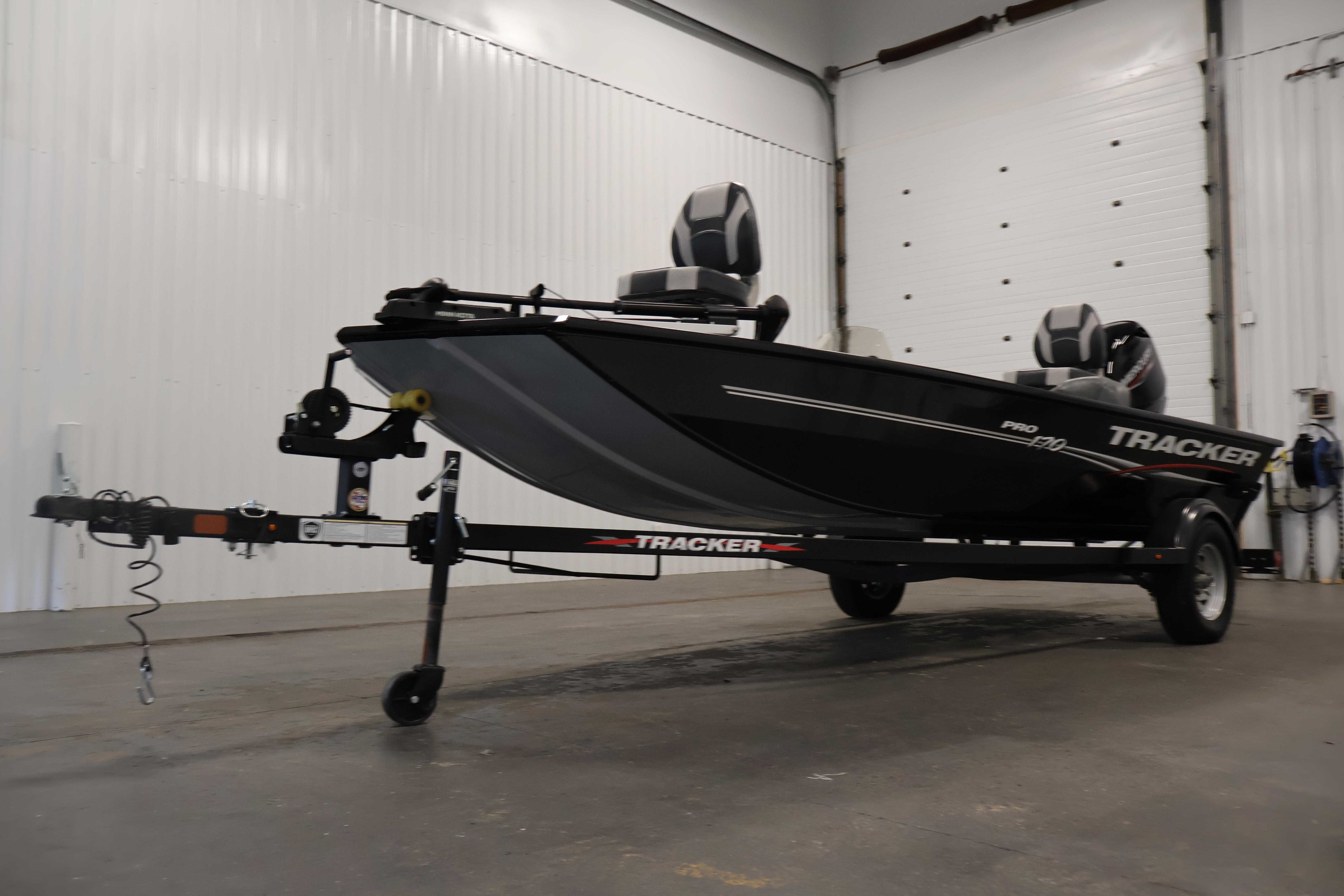 2024 Tracker Pro 170 boat on trailer in indoor storage facility.