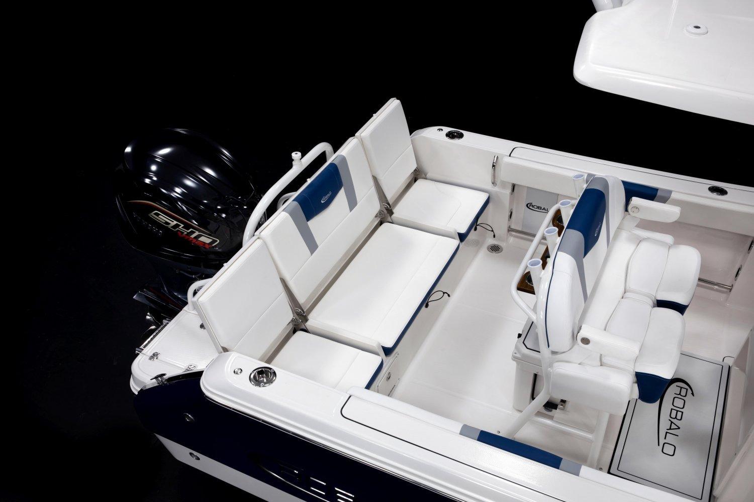 Manufacturer Provided Image: 2026 Robalo R232 Explorer boat interior with seating and engine detail.