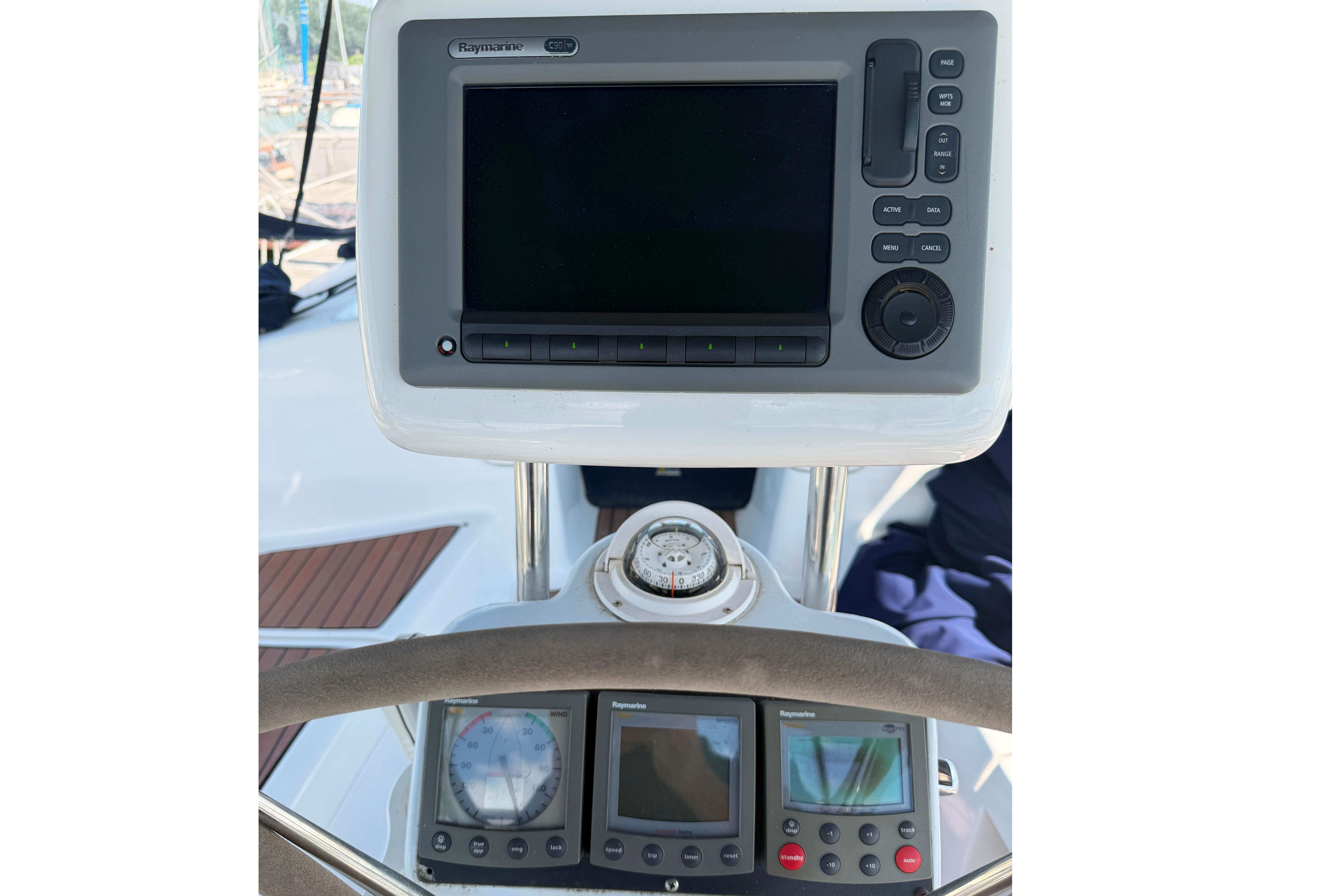 Control panel of a 2005 Hunter 38 sailboat with navigation instruments.