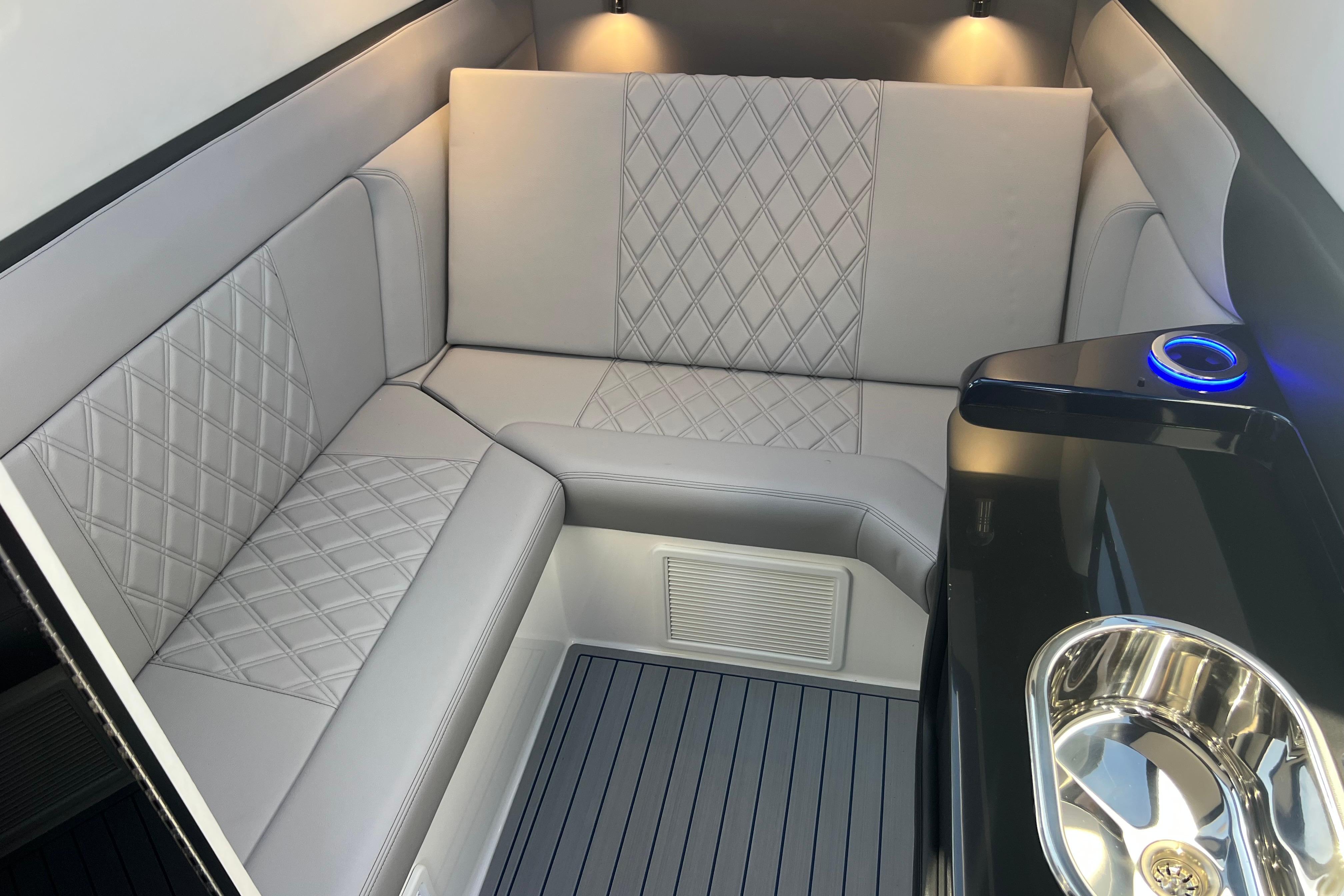 Luxurious interior of 2026 Nor-Tech 450 Sport boat with elegant seating and modern amenities.