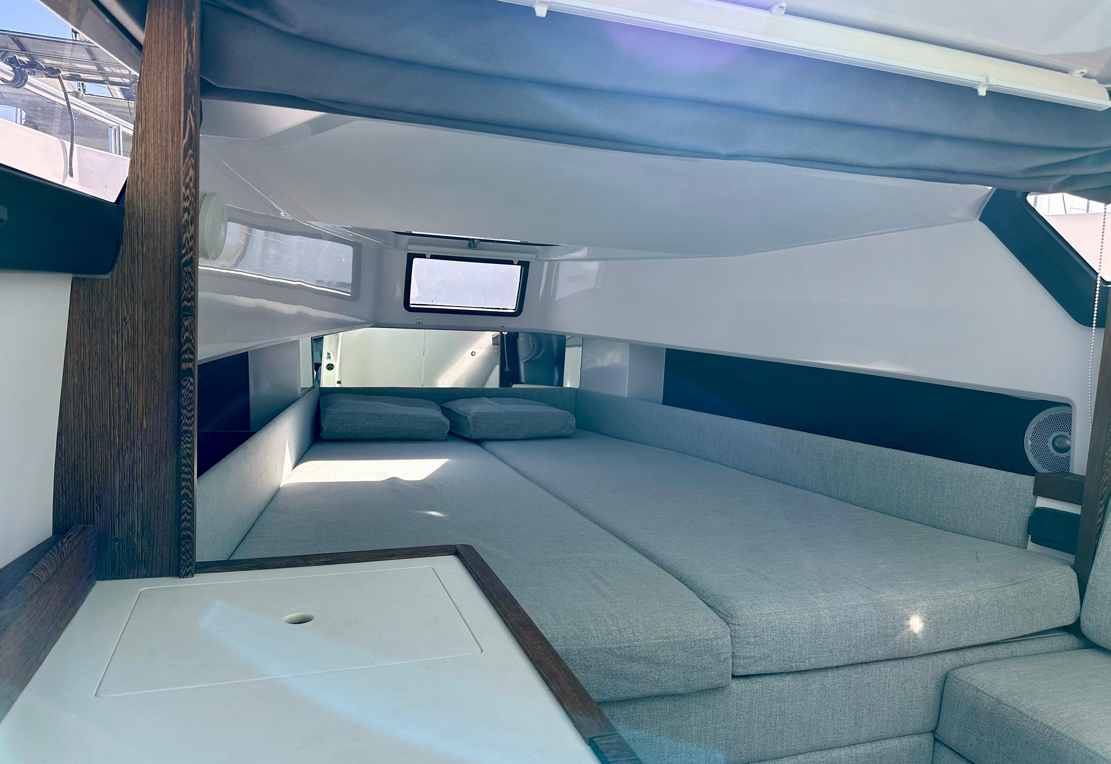 2018 Axopar 37 Cross Cabin interior with spacious bed and modern design.