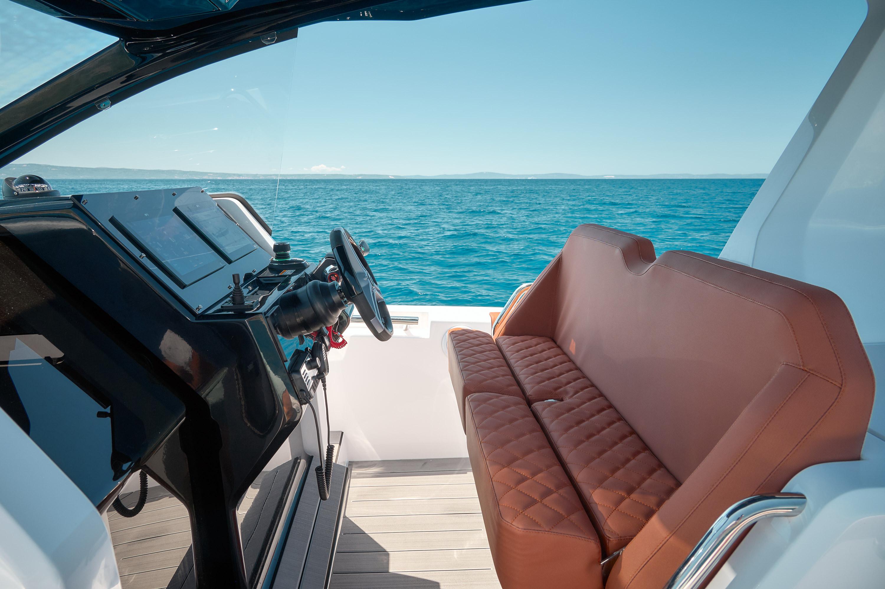 Luxury Pirelli 35 yacht interior with leather seating, ocean view, 2025 model.