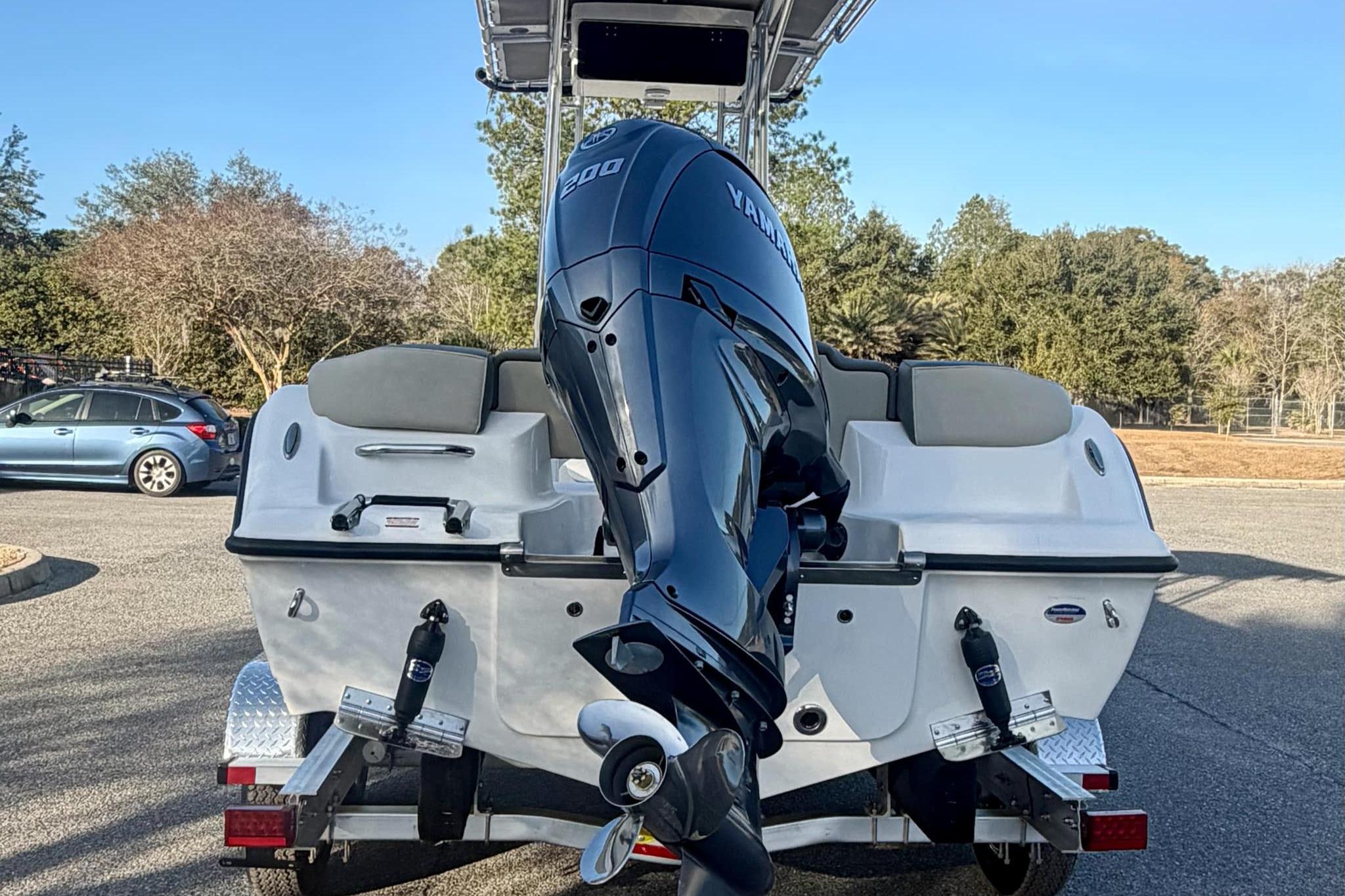 2026 Key West 203 FS boat with Yamaha engine on trailer in parking lot.